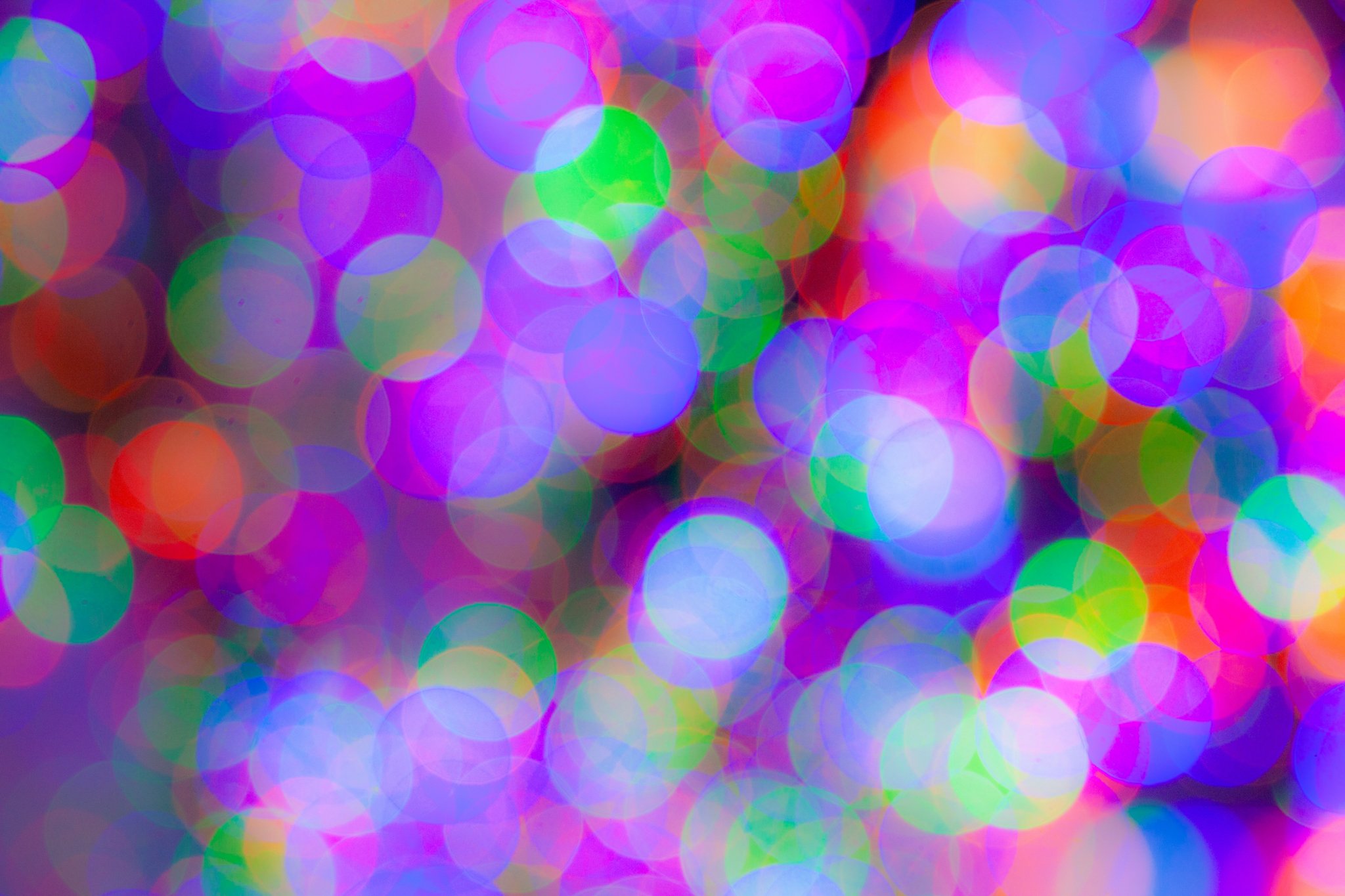 Colorful blurred lights and circles creating a vibrant, abstract pattern.