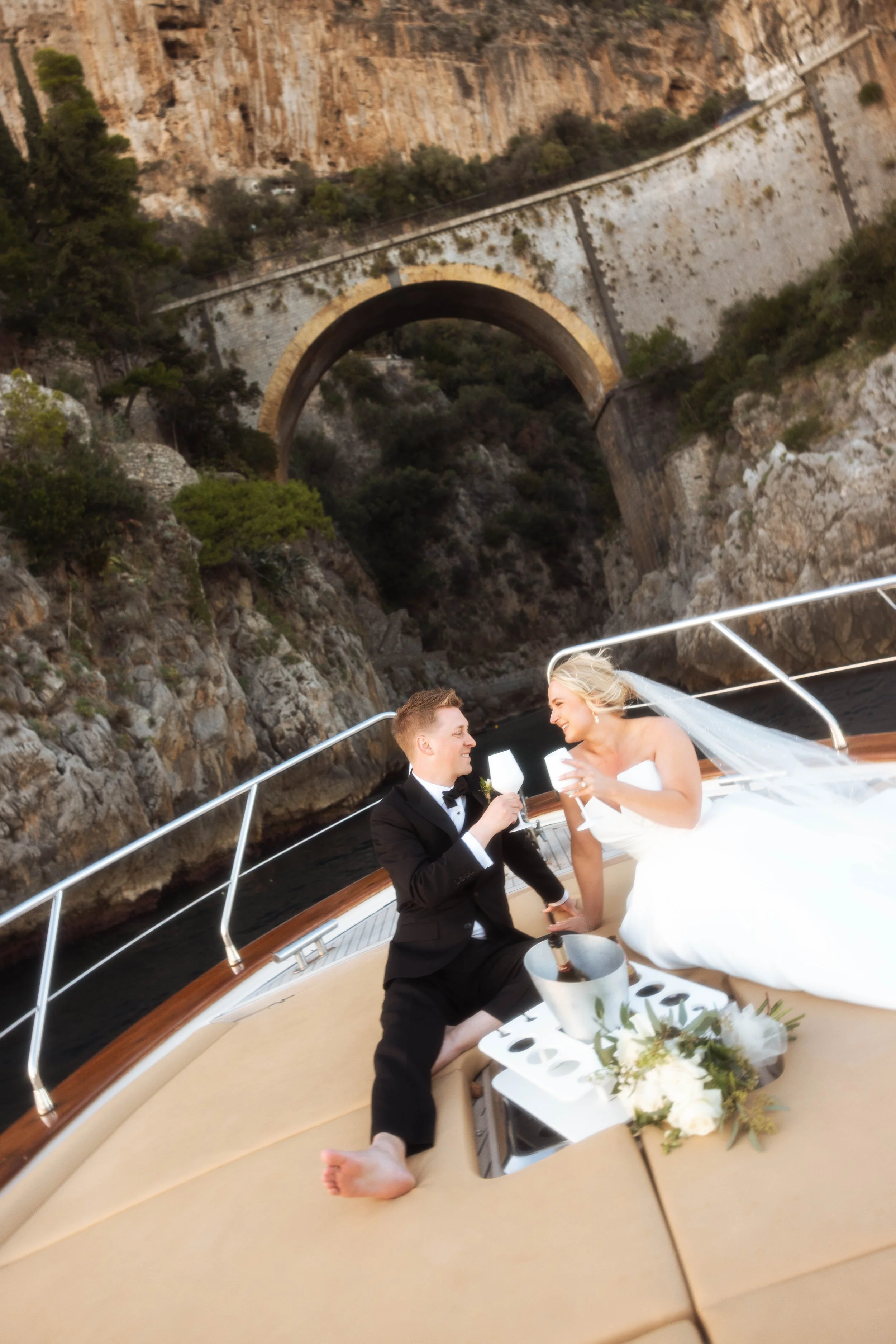 A bride and groom on a boat on the Amalfi Coast