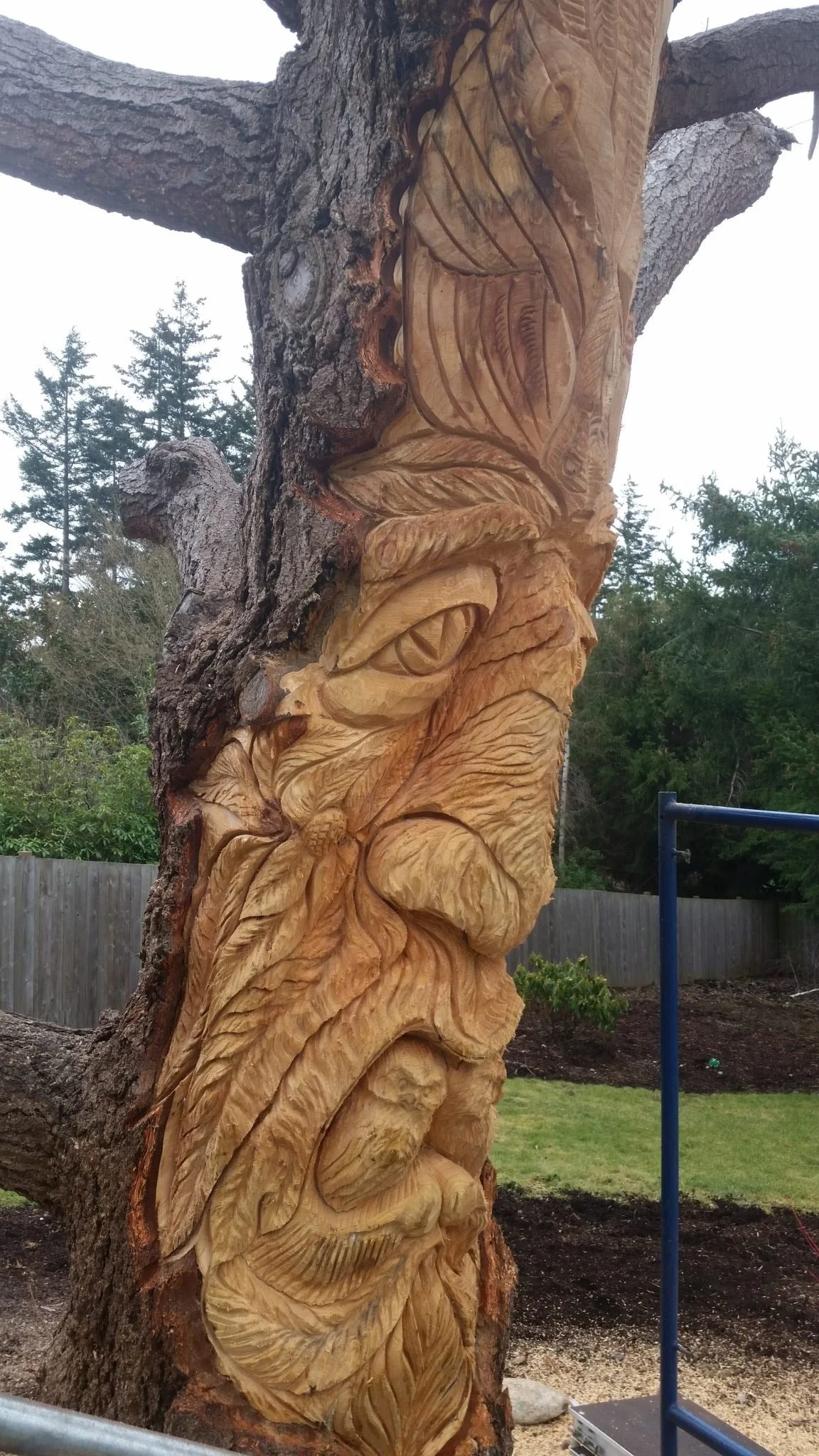 tree spirit in progress detailed leaves by chainsaw carver Tomas Vrba