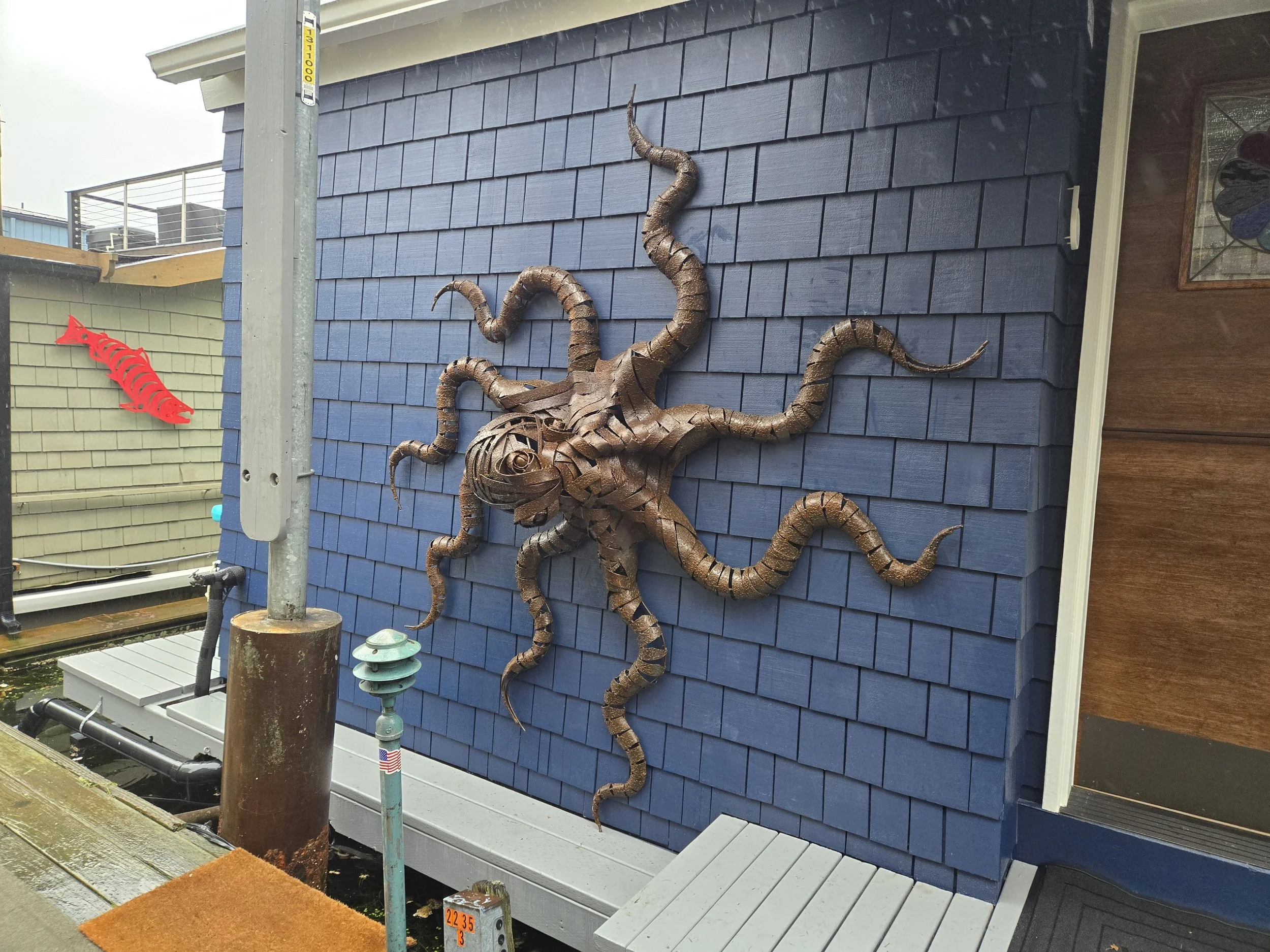 Metal octopus sculpture on houseboat in Seattle