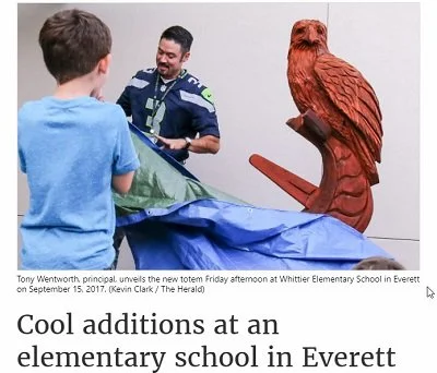 An eagle mascot wood sculpture created for elementary school in Everett Washington by chainsaw carver Tomas Vrba.