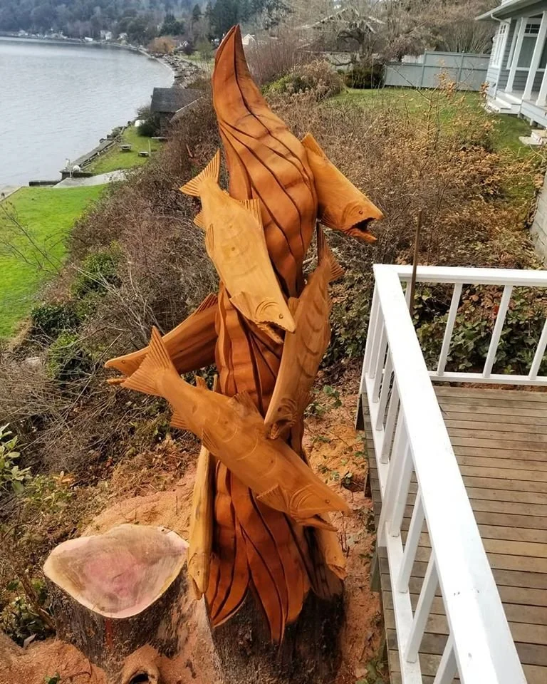 Tree stump sculpture by Tomas Vrba of Bellingham, WA displayed at private residence in Seattle, created with chainsaw