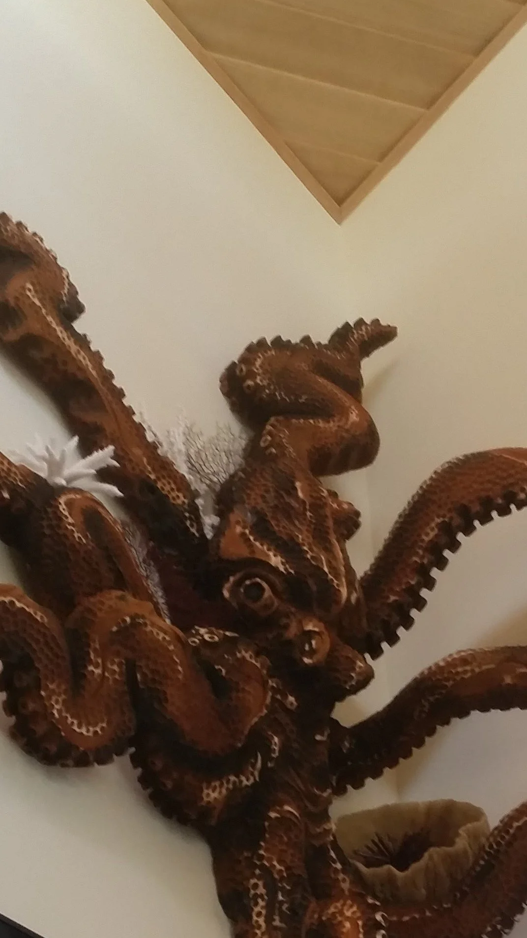 closeup of octopus sculpture on wall created by chainsaw sculptor Tomas Vrba