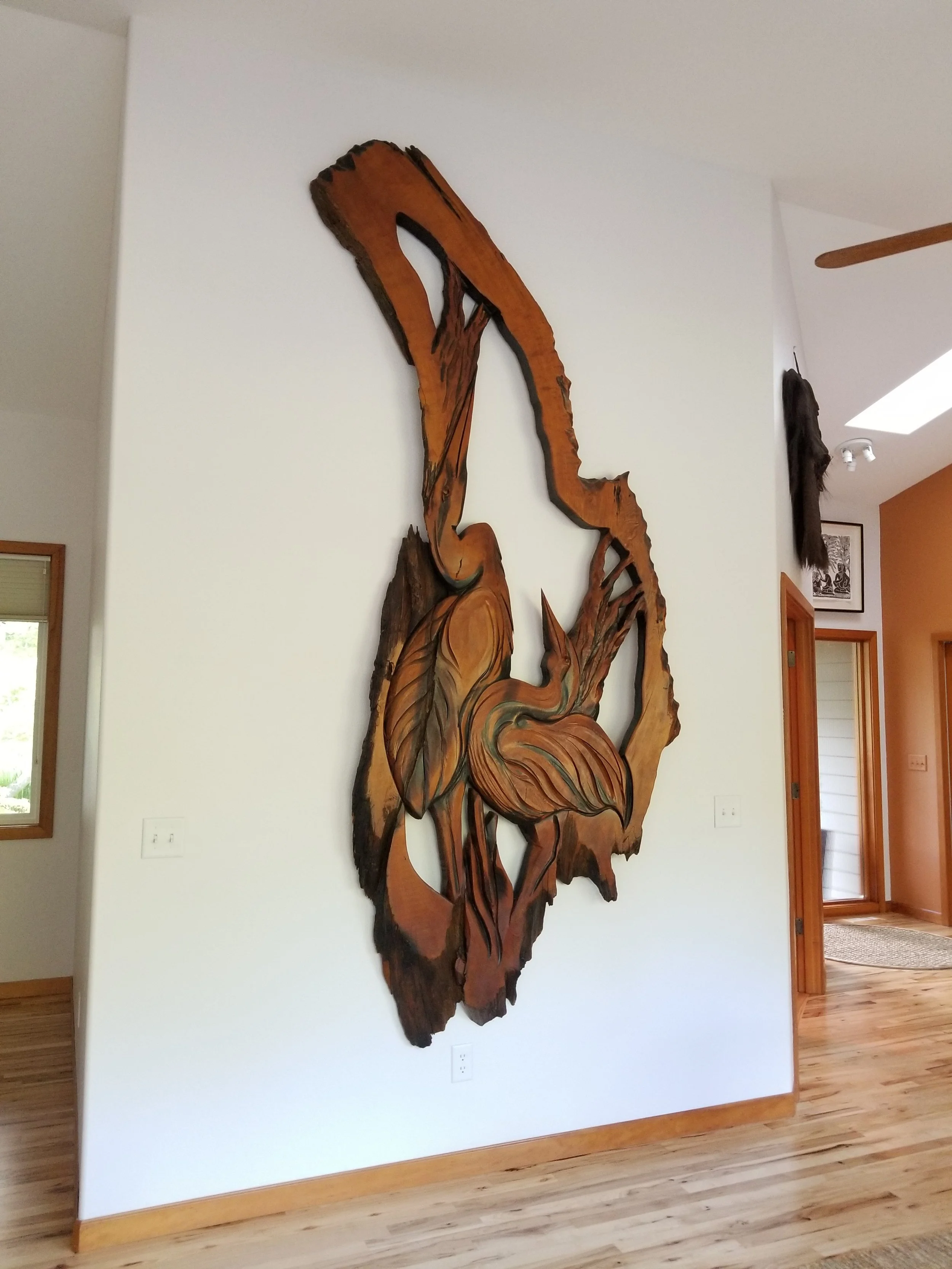 Large heron relief in old growth cedar by Tomas Vrba, displayed at private residence in Ferndale, WA