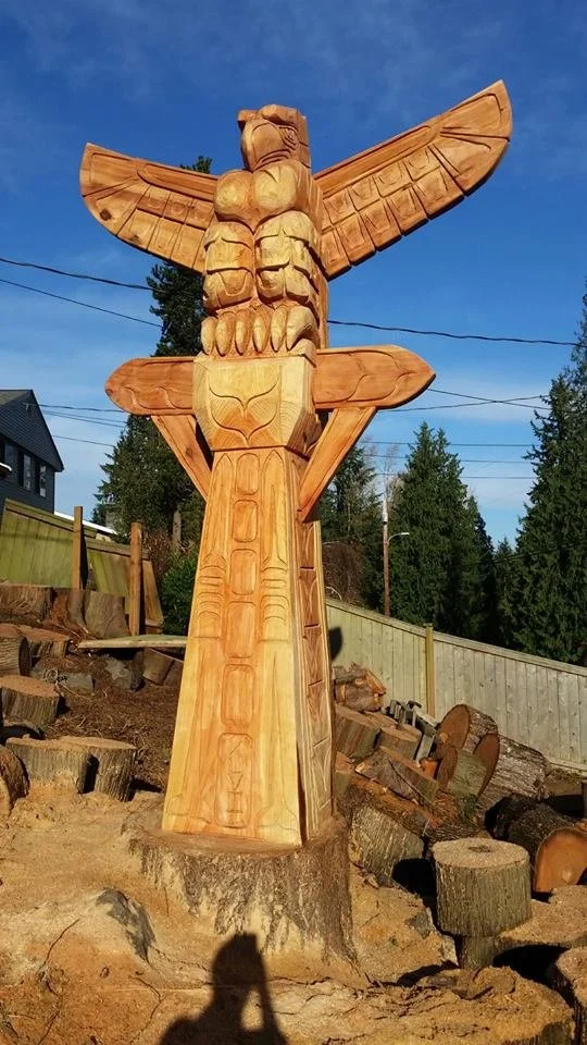 Wooden carved Seahawks totem pole created by chainsaw carver Tomas Vrba, commissioned to celebrate the Seahawks' Superbowl win.