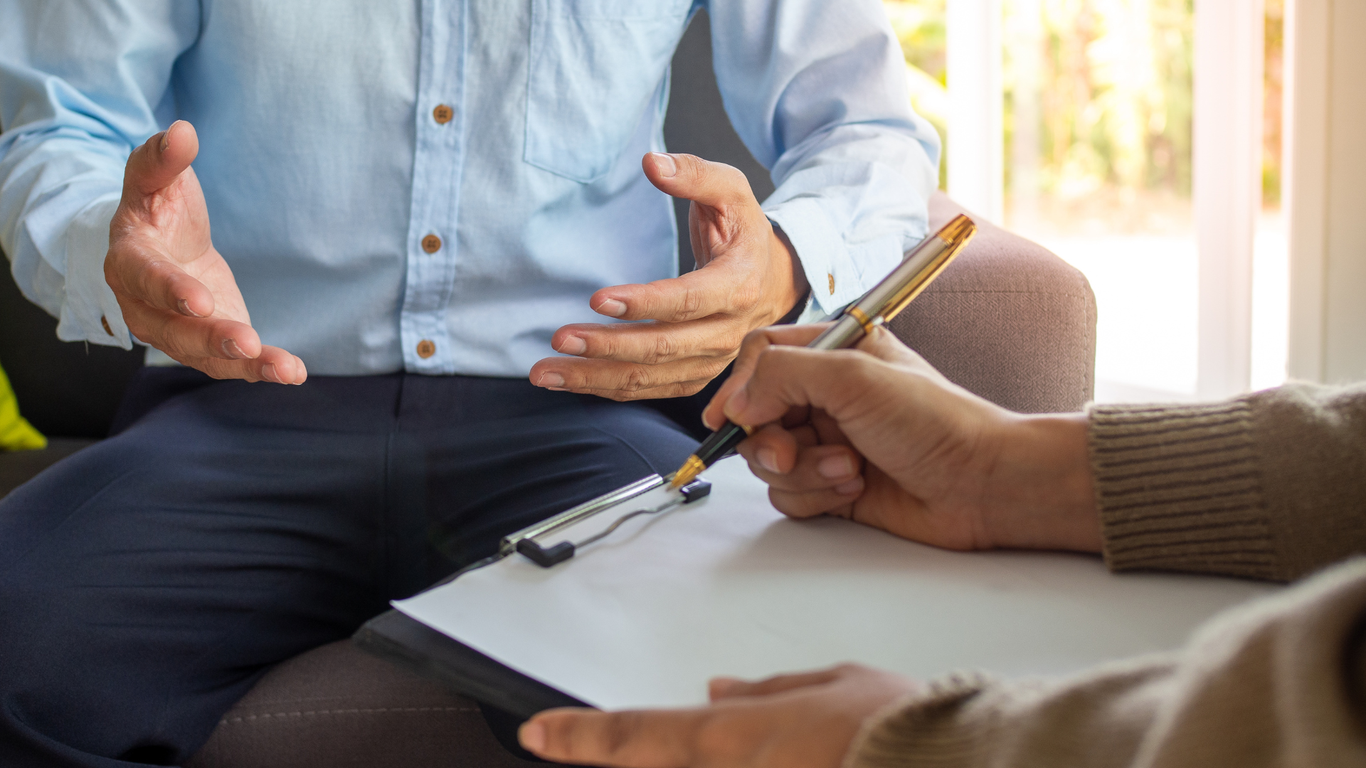 man consulting psycholosit and writing