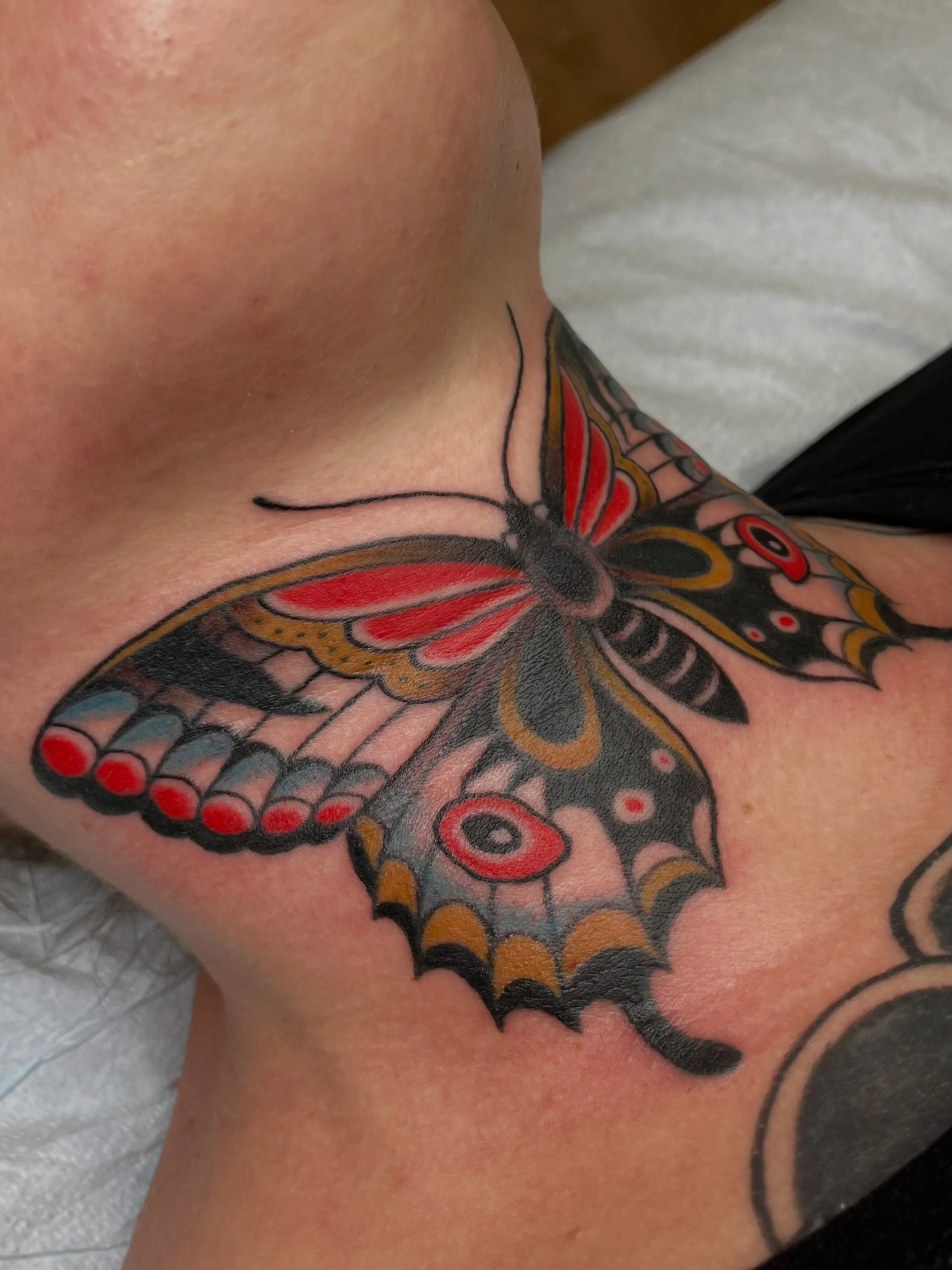 What an honor to tattoo this butterfly on @mollytroxler&rsquo;s throat! Molly is a delight to hang out with and also a badass tattooer. You can find her in Sequim @coastallinestattooemporium. And she also brought me a giant bag of mini chic-o-sticks 