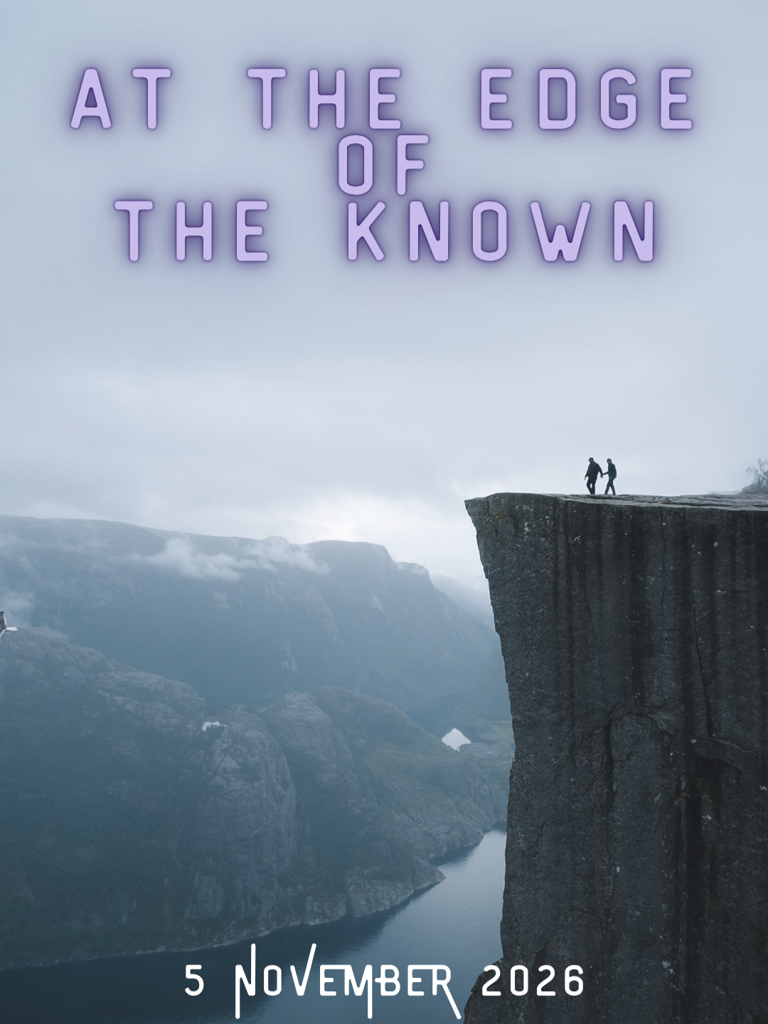 Two people hold hands while standing on the edge of a cliff overlooking a river and mountain range on a cloudy day with text "At the Edge of the Known" and date "5 November 2026".