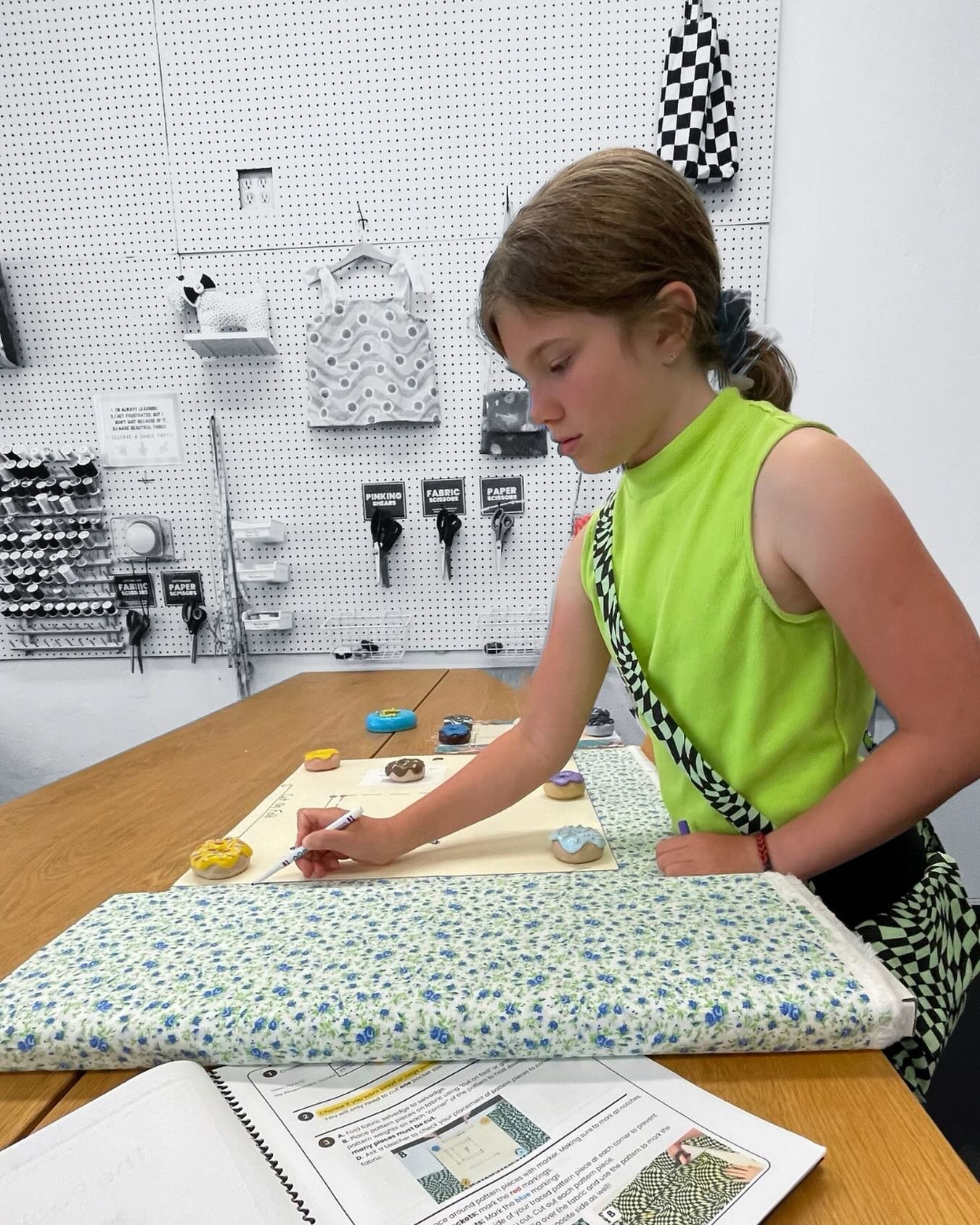 Our student wearing her own handmade purse while starting on a new project! ⭐️
 We are so excited when we see the students really start to &ldquo;get it&rdquo;. 
🔹placing a pattern correctly
🔹marking the notches 
🔹being able to identify the selved