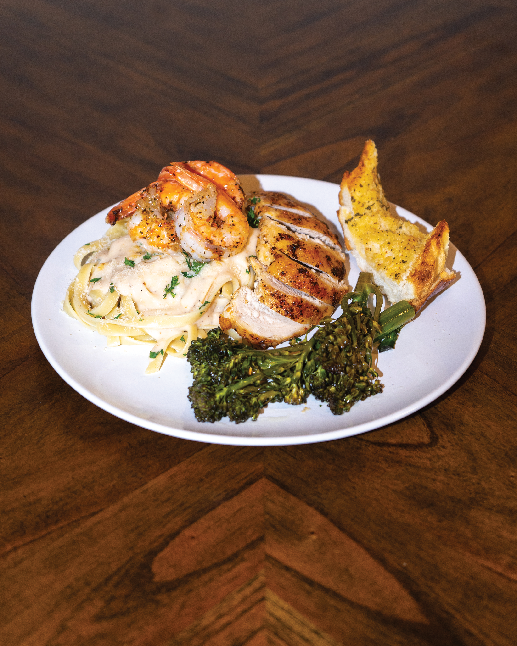 Sheared Prawns, and Cajun Blackened Chicken Breast, Creamy Alfredo Sauce Over Browned Butter Pasta