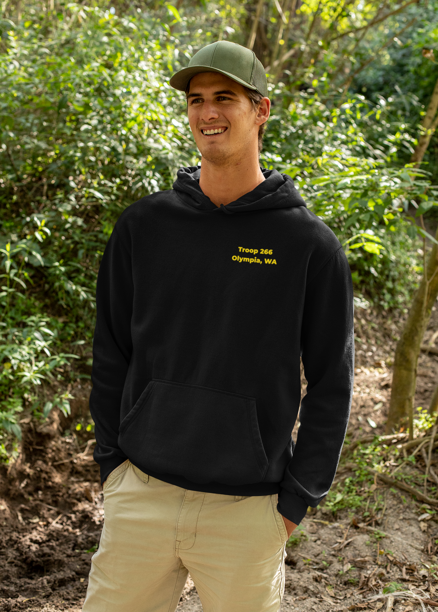 mockup-of-a-happy-man-wearing-a-hoodie-in-the-woods-32227.png