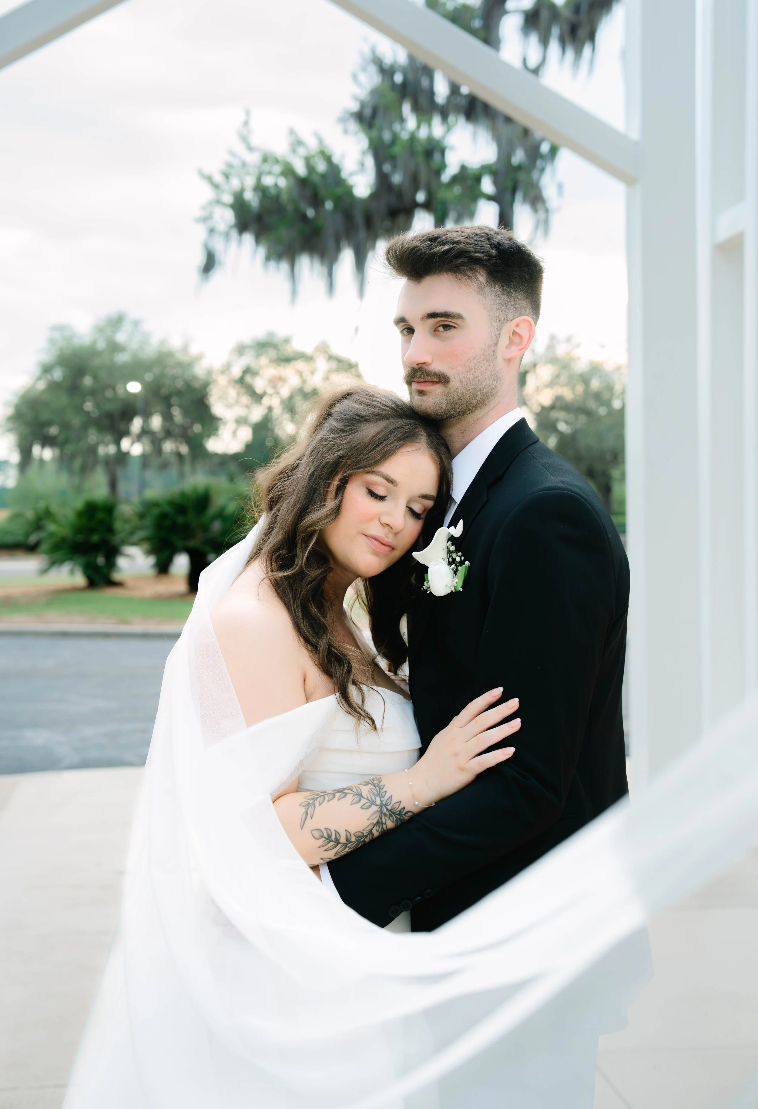 A Newly Wed Couple Poses for their Portraits at a Jacksonville Church Photographed and Filmed by LUX Photo + Film