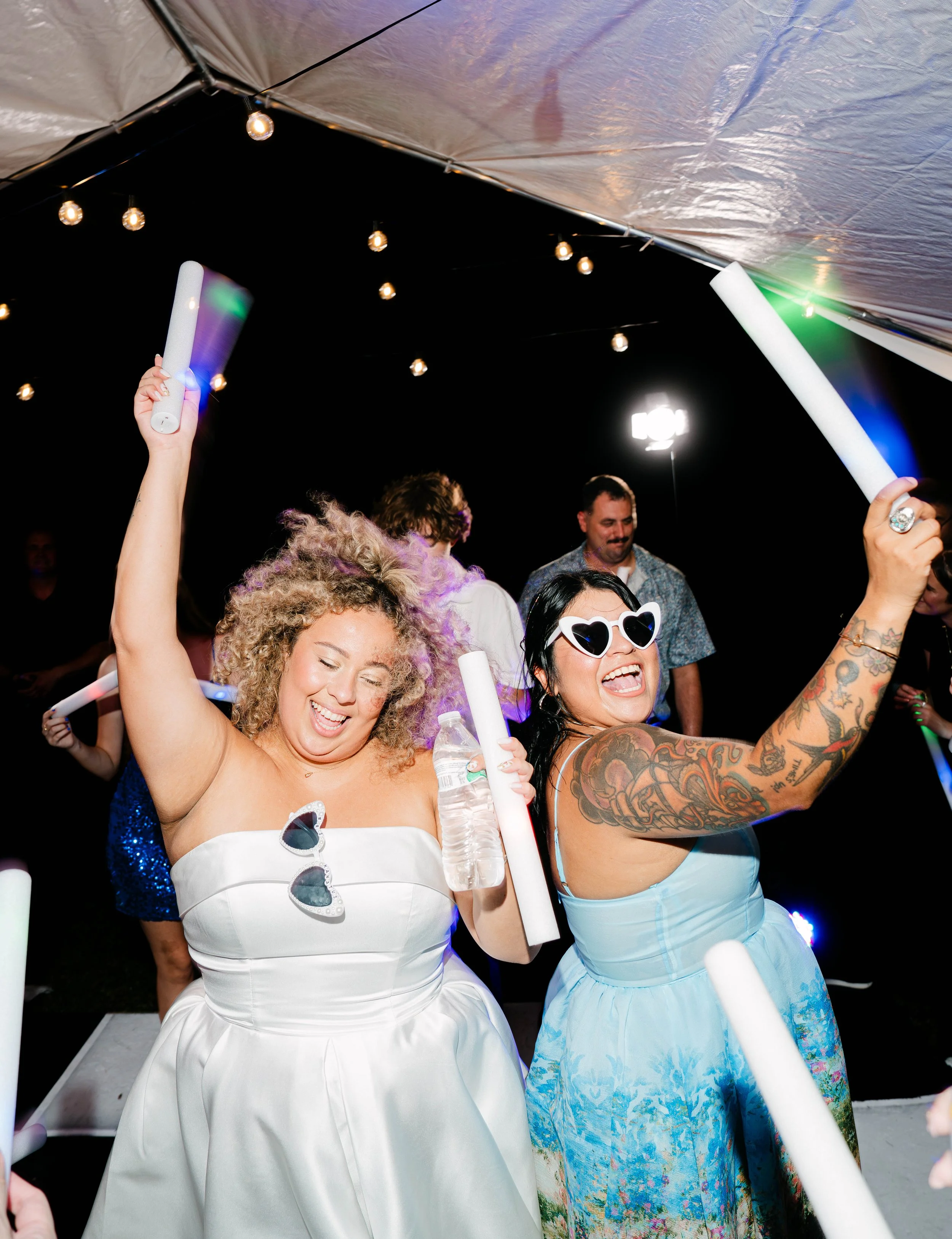 A lively colorful dance floor moment, featuring a technique called shutter drag, at an Airbnb in Kingsland South Georgia photographed by LUX Photo + Film