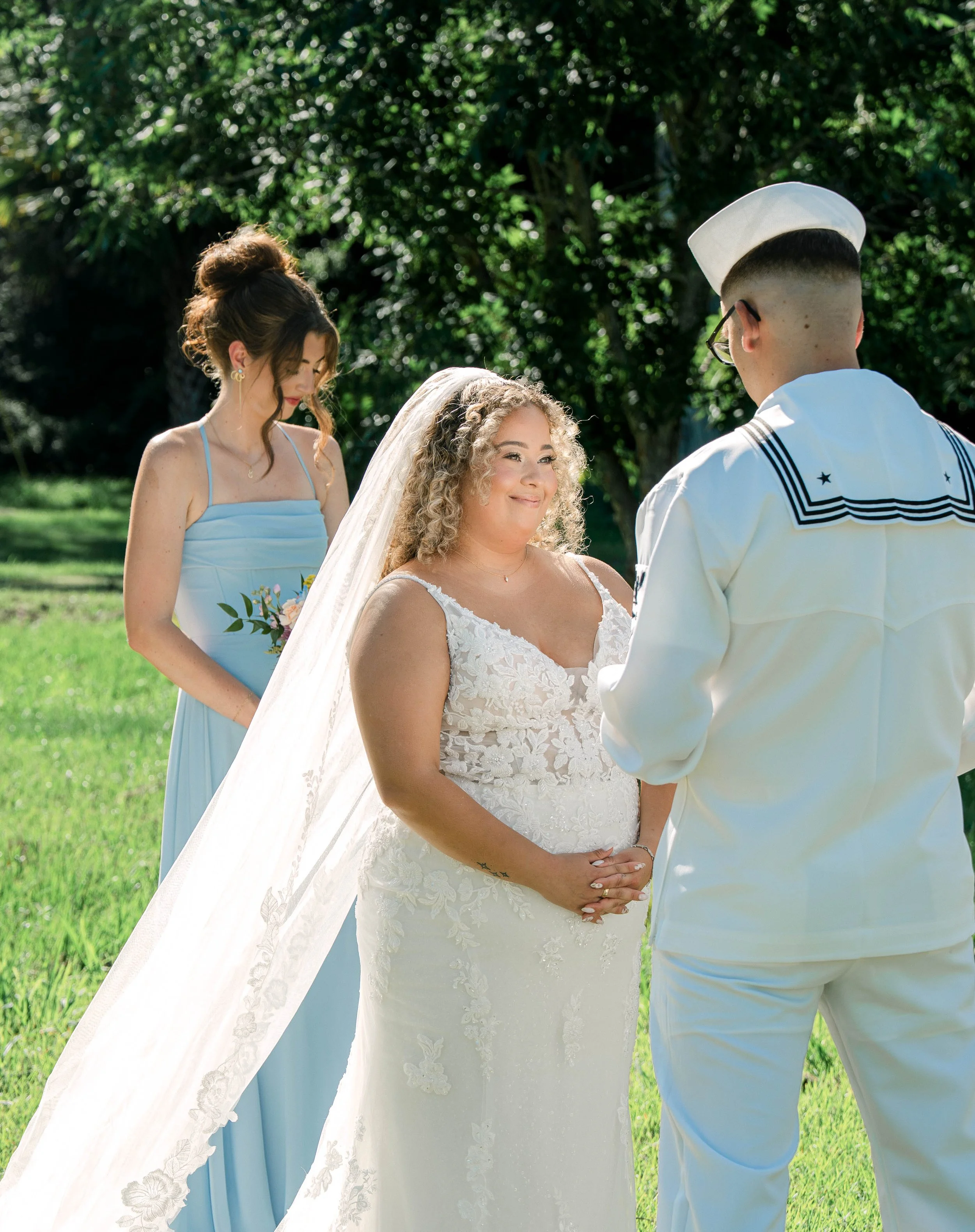 A Bride looking at her groom while reciting her vows at an Airbnb in Kingsland South Georgia, photographed by LUX Photo + Film
