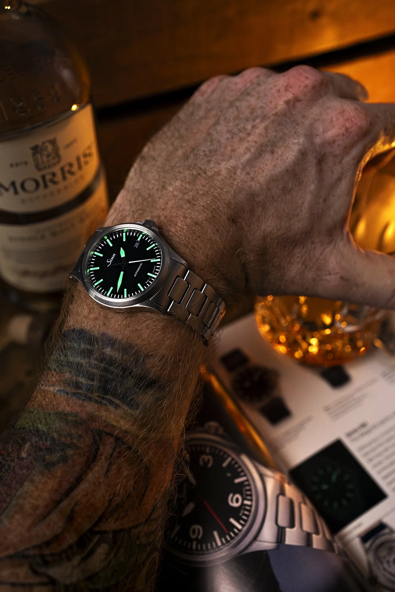 Sinn 556 with a glass of whiskey