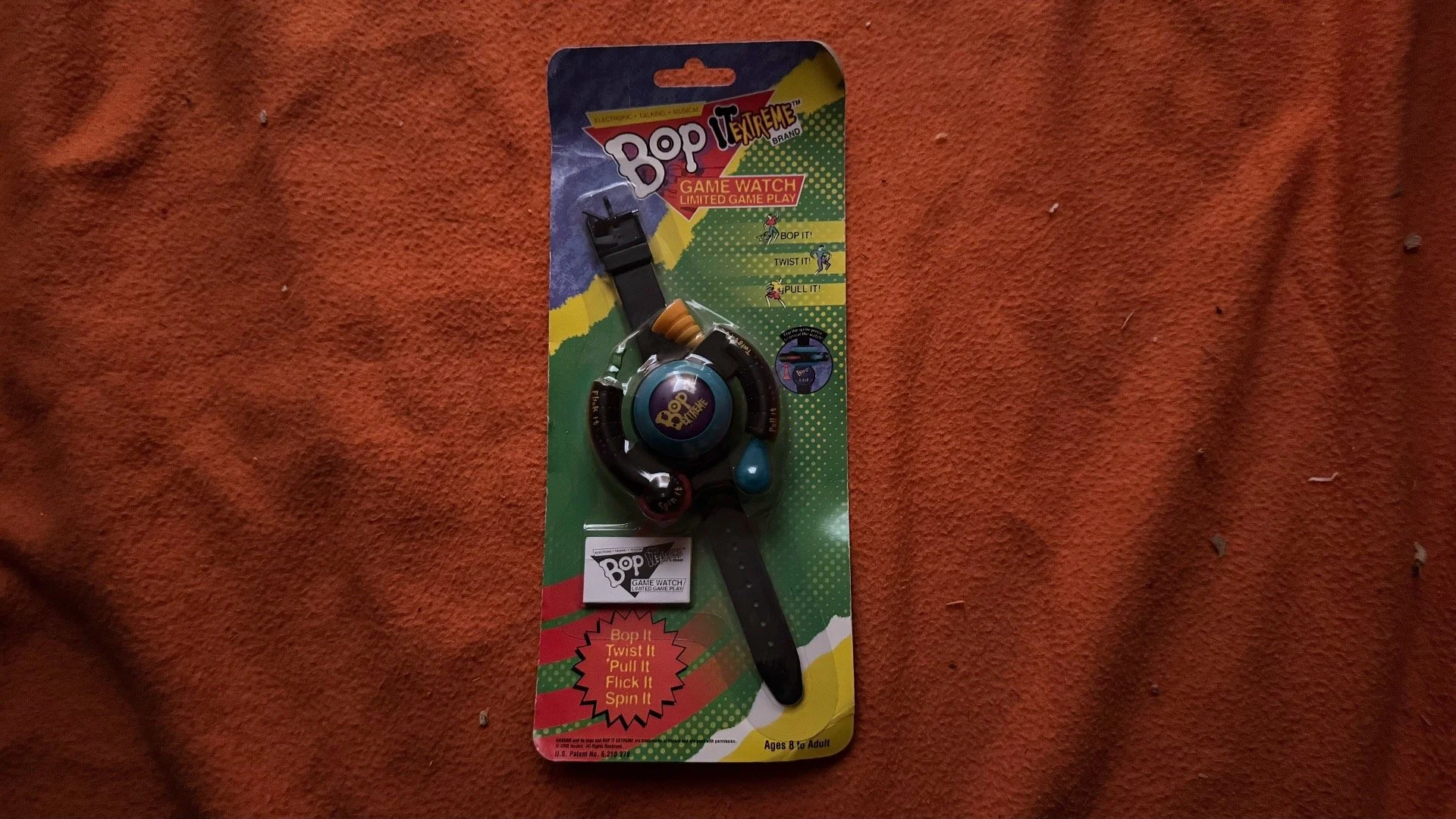Name: Bop It Extreme Game Watch  •  Release Year: 2002  •  Revision Number: Unknown  •  Test Mode Length: Unknown