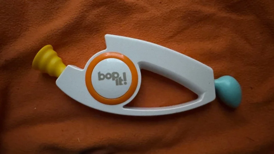 Name: Bop It!  •  Version 2.0  •  Release Year: 2020  •  Revision Number: Score 5  •  Test Mode Length: 0m 39s  •  Changes: Volume goes backwards (Loud, Quiet, Blasting), Better speaker