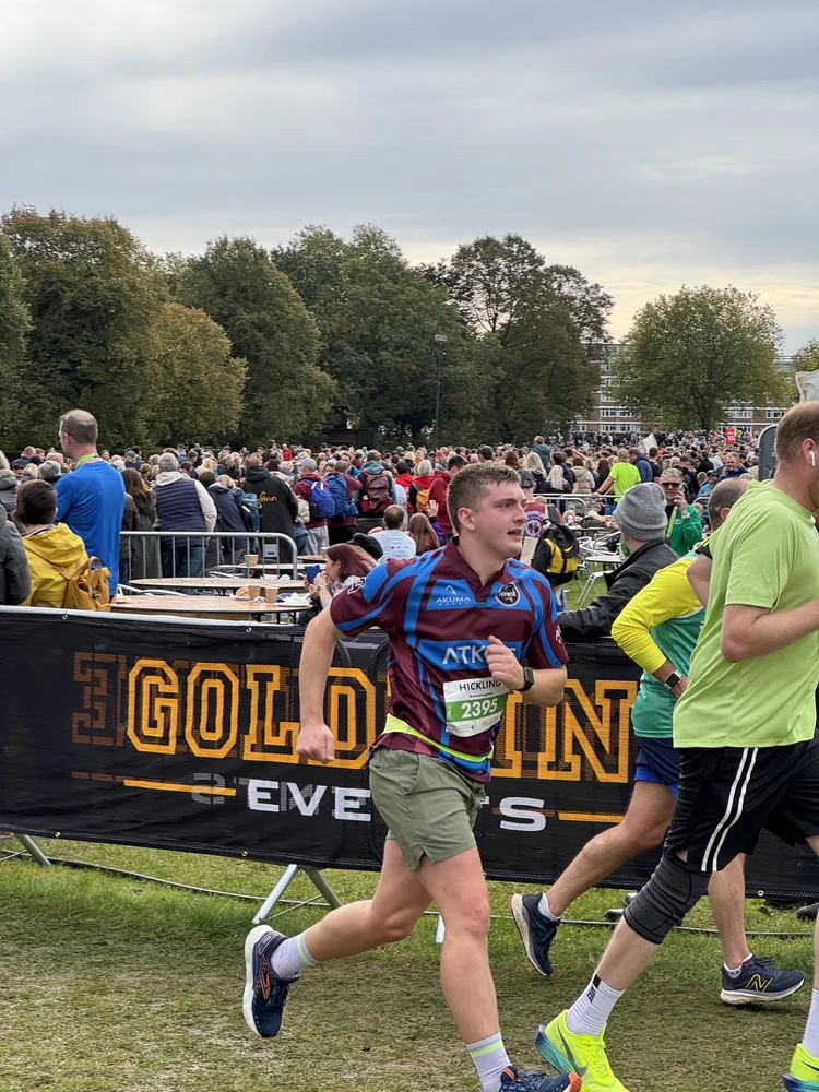 Tom Hickling, TrailMed Health & Performance Lead, running in a race