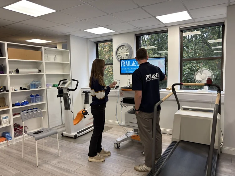 A member of the TrailMed clinical team with a client in the lab in Syston