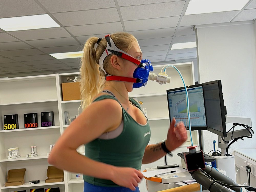 Athlete on a treadmill wearing a metabolic testing mask during a FatMax fuelling test in Leicester