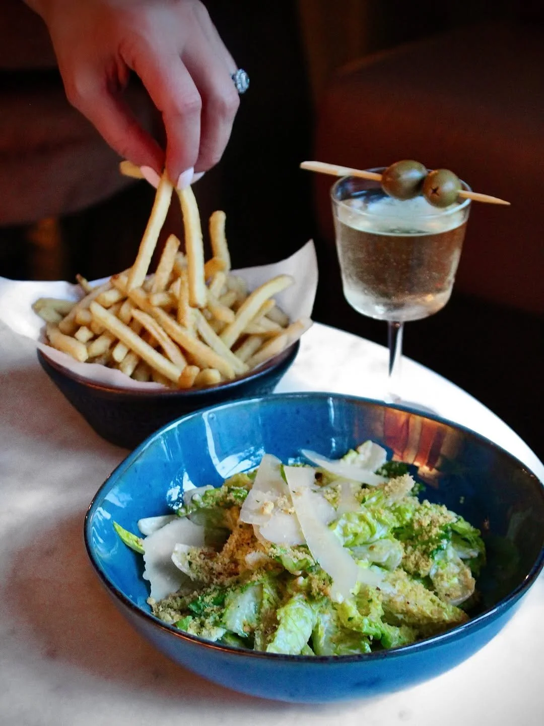 Classic Caesar salad, crispy hot fries and a martini