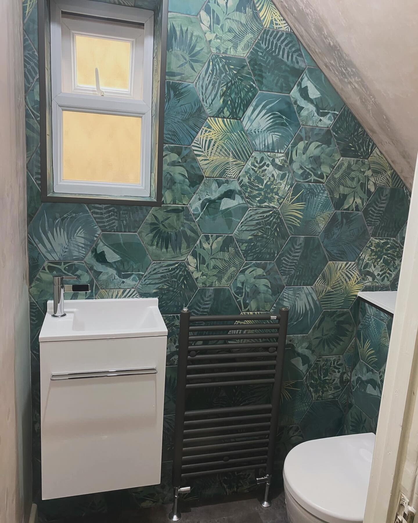 We just love these Jungle tiles by @capietra - this cloakroom under the stairs has now come to life boasting clean lines and design flair. Designed . Supplied. Installed by Dajon Interiors #cloakroomdesign #cloakroom