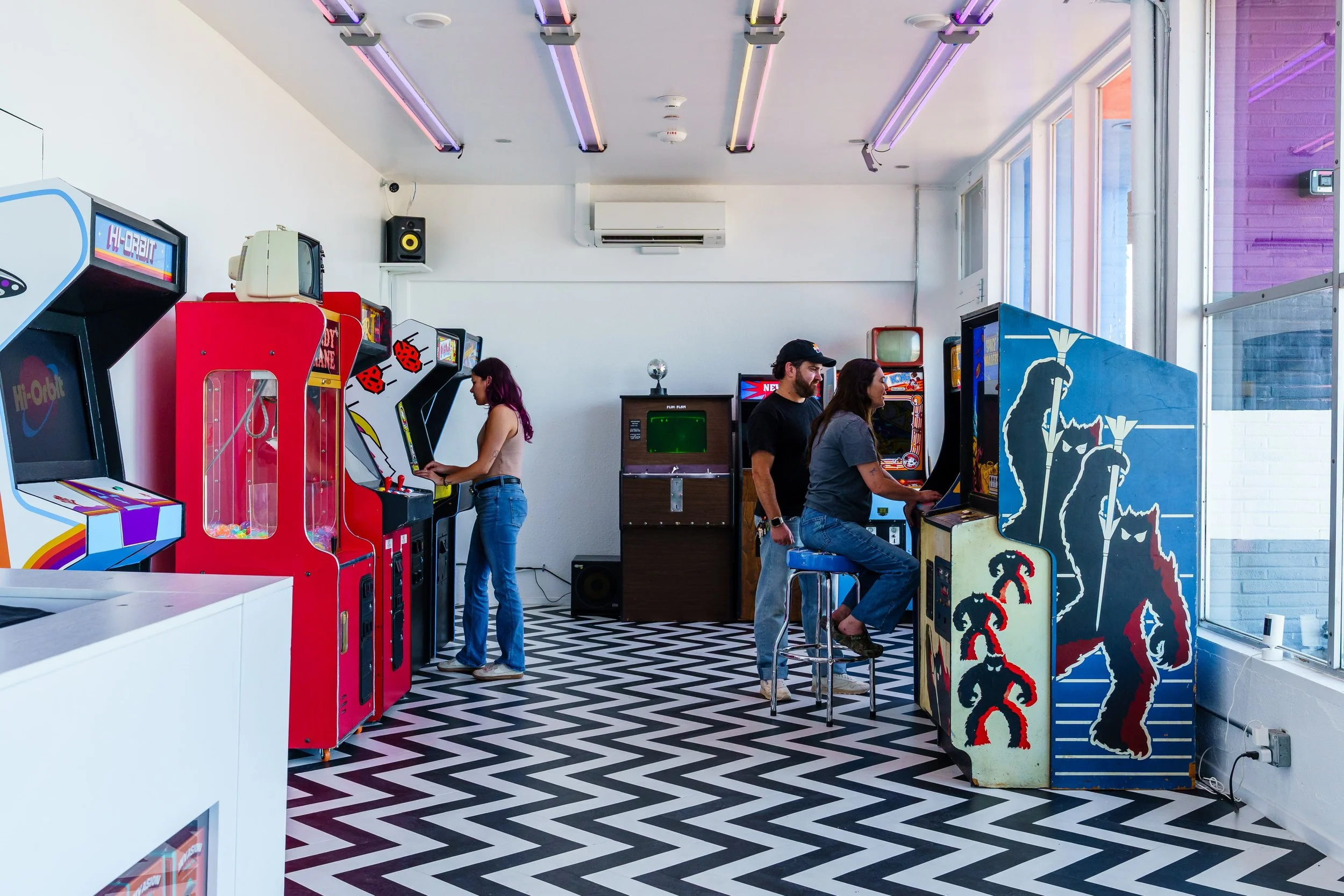 Hi-Orbit Games Arcade with Players on Games