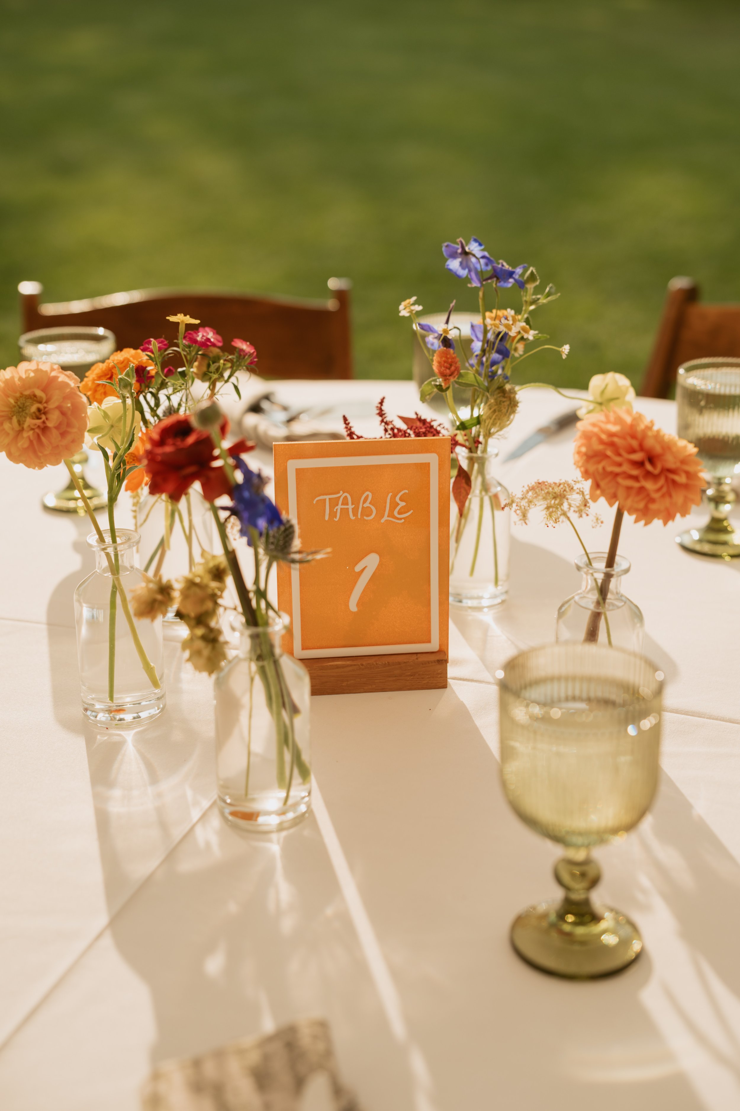 Custom wedding table numbers, colorful and fun design, personalized table numbers for weddings, vibrant and funky wedding signage, perfect for wedding receptions in Central Oregon and beyond.