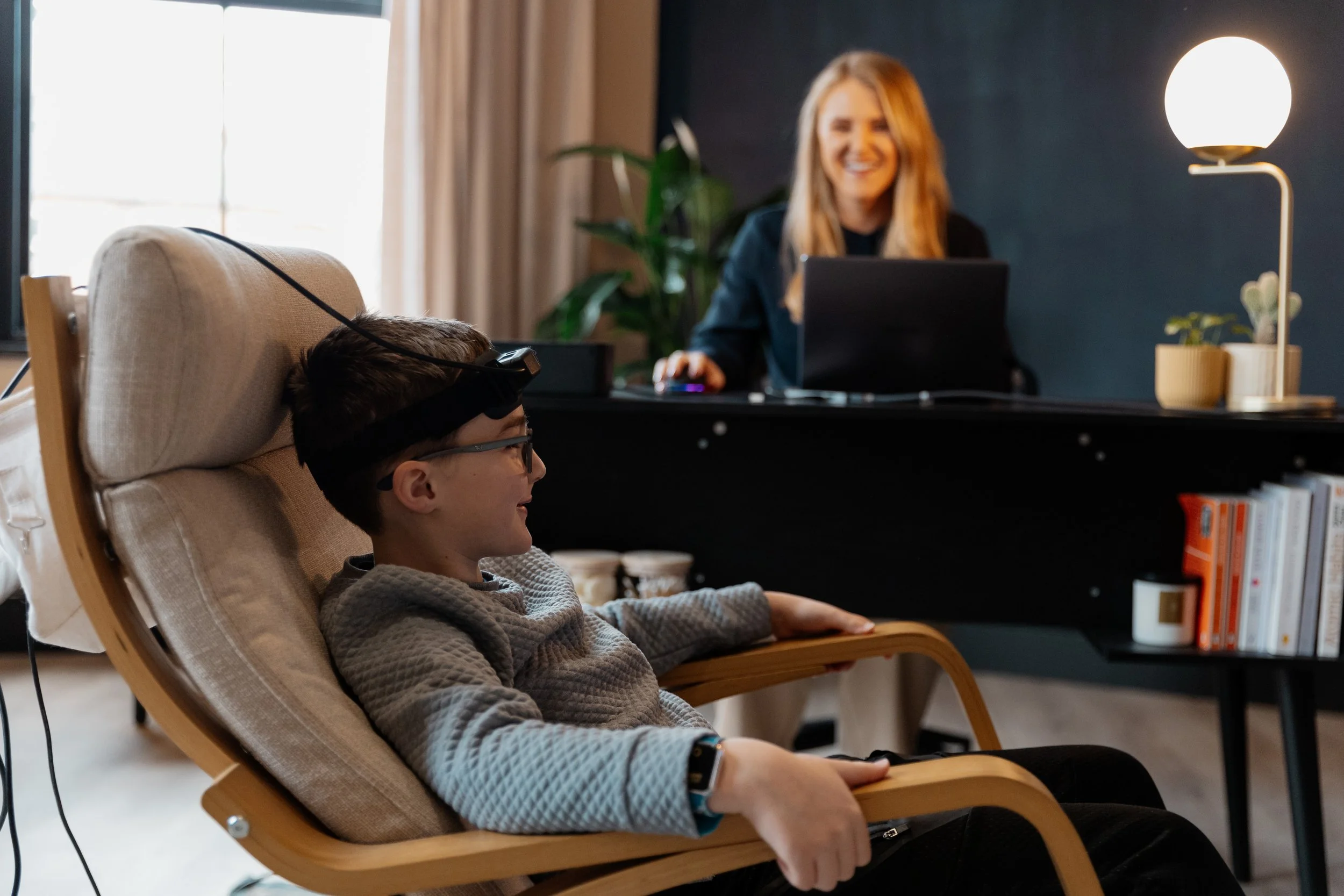 child enjoying his neurofeedback session with Lauren