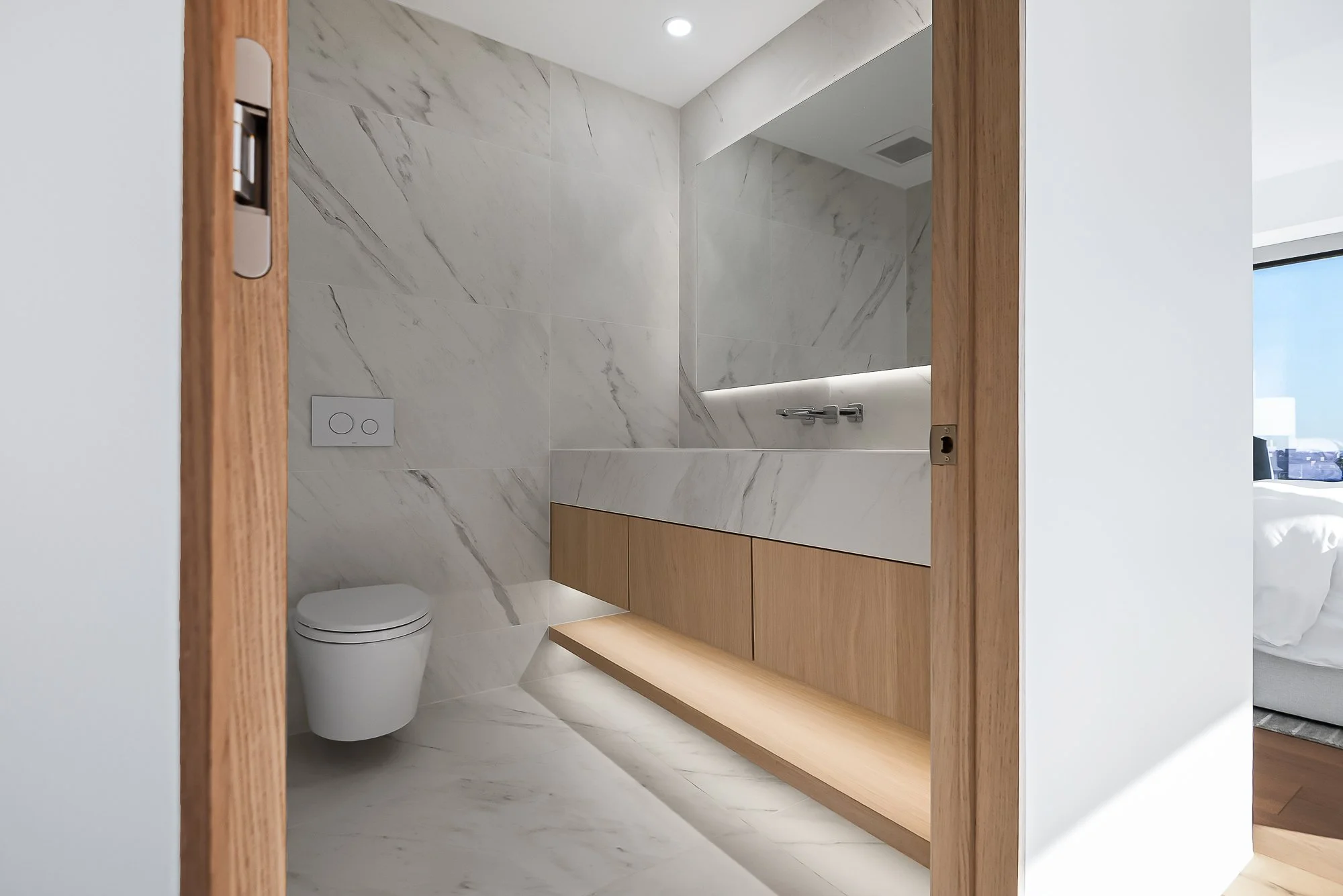 Custom-built white oak floating vanity by Madley Fine Cabinetry