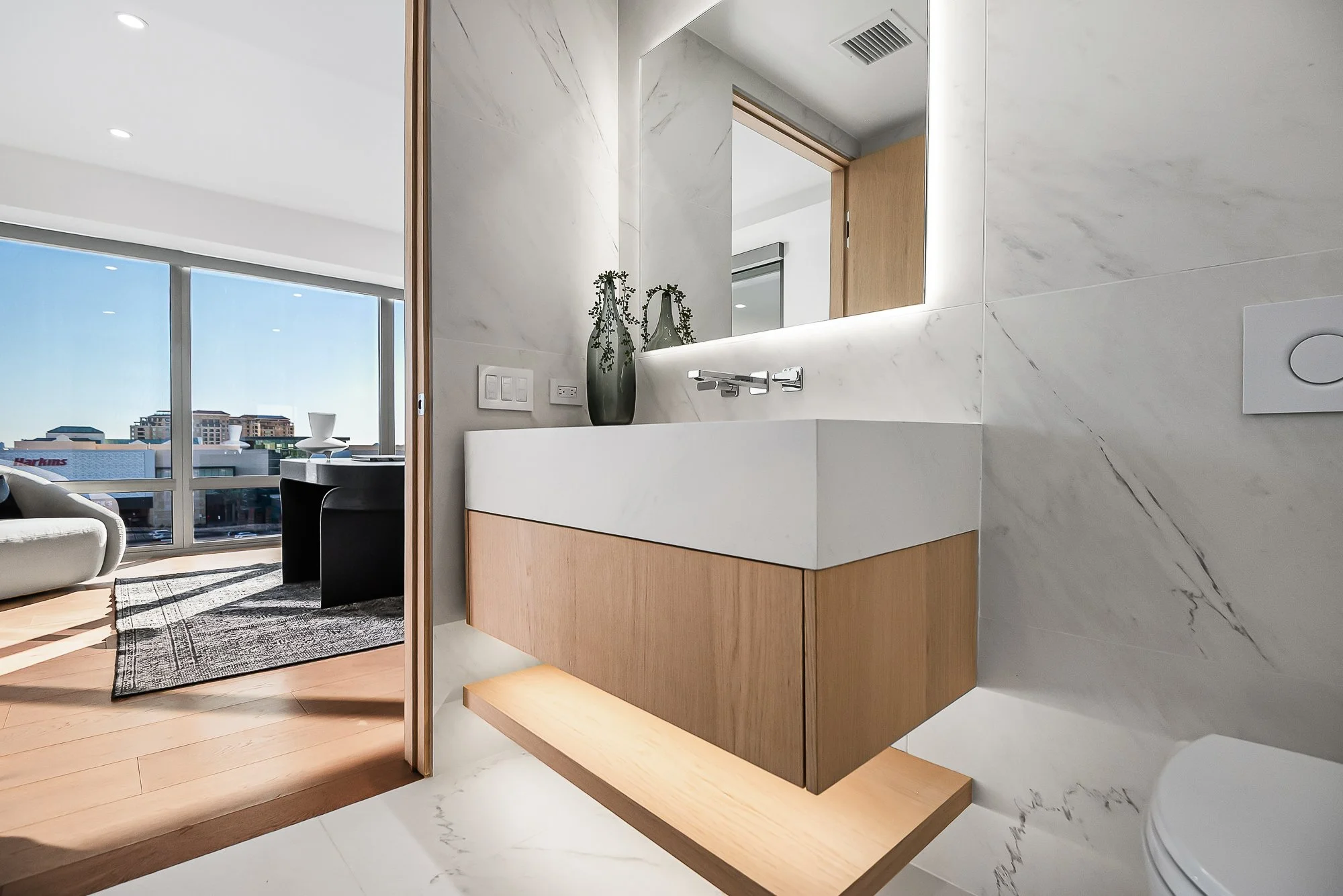 Custom-built white oak floating vanity by Madley Fine Cabinetry