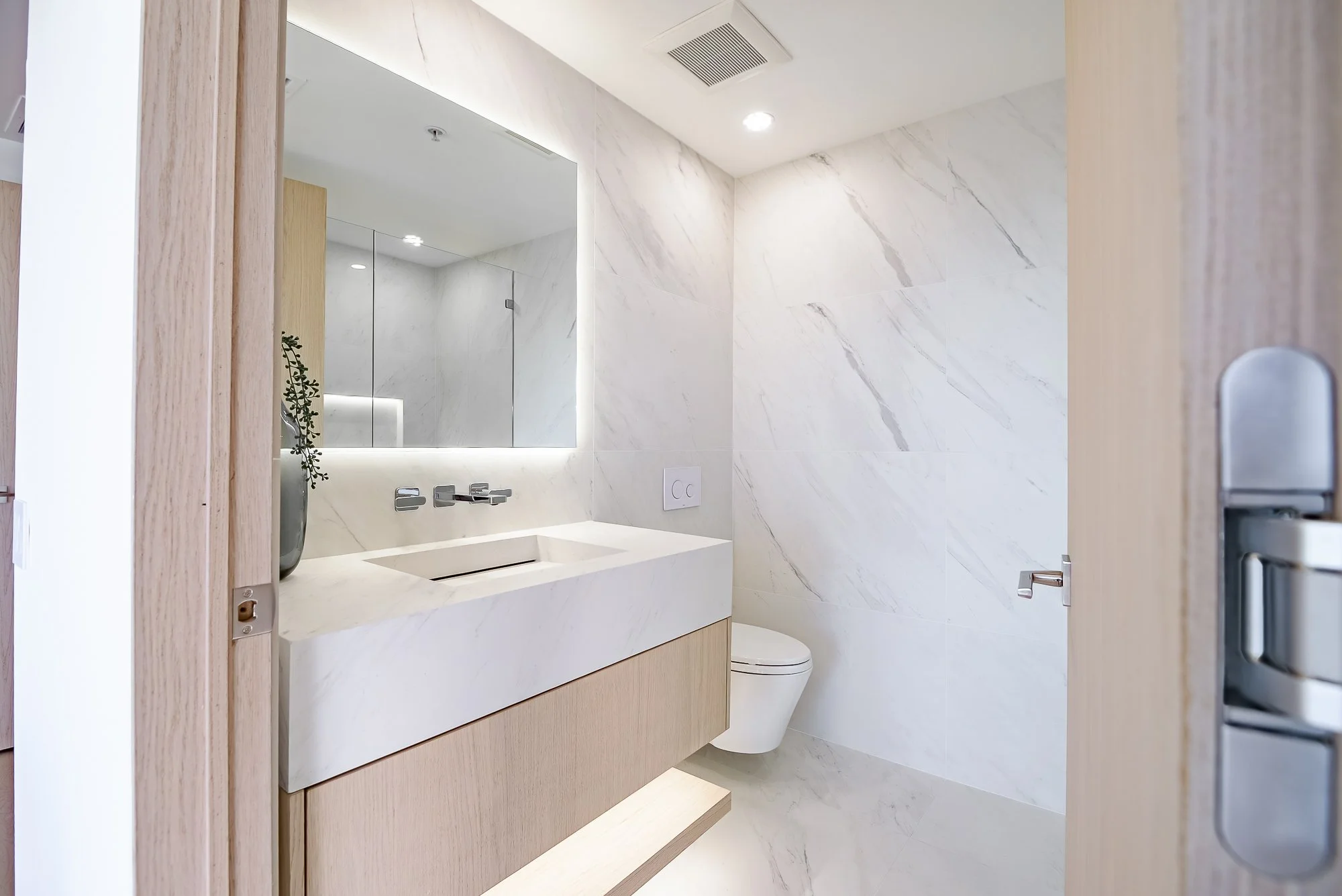 Custom-built white oak floating vanity by Madley Fine Cabinetry