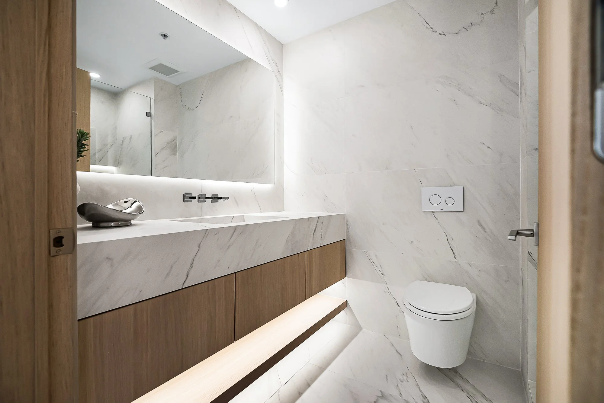 Custom-built white oak floating vanity by Madley Fine Cabinetry