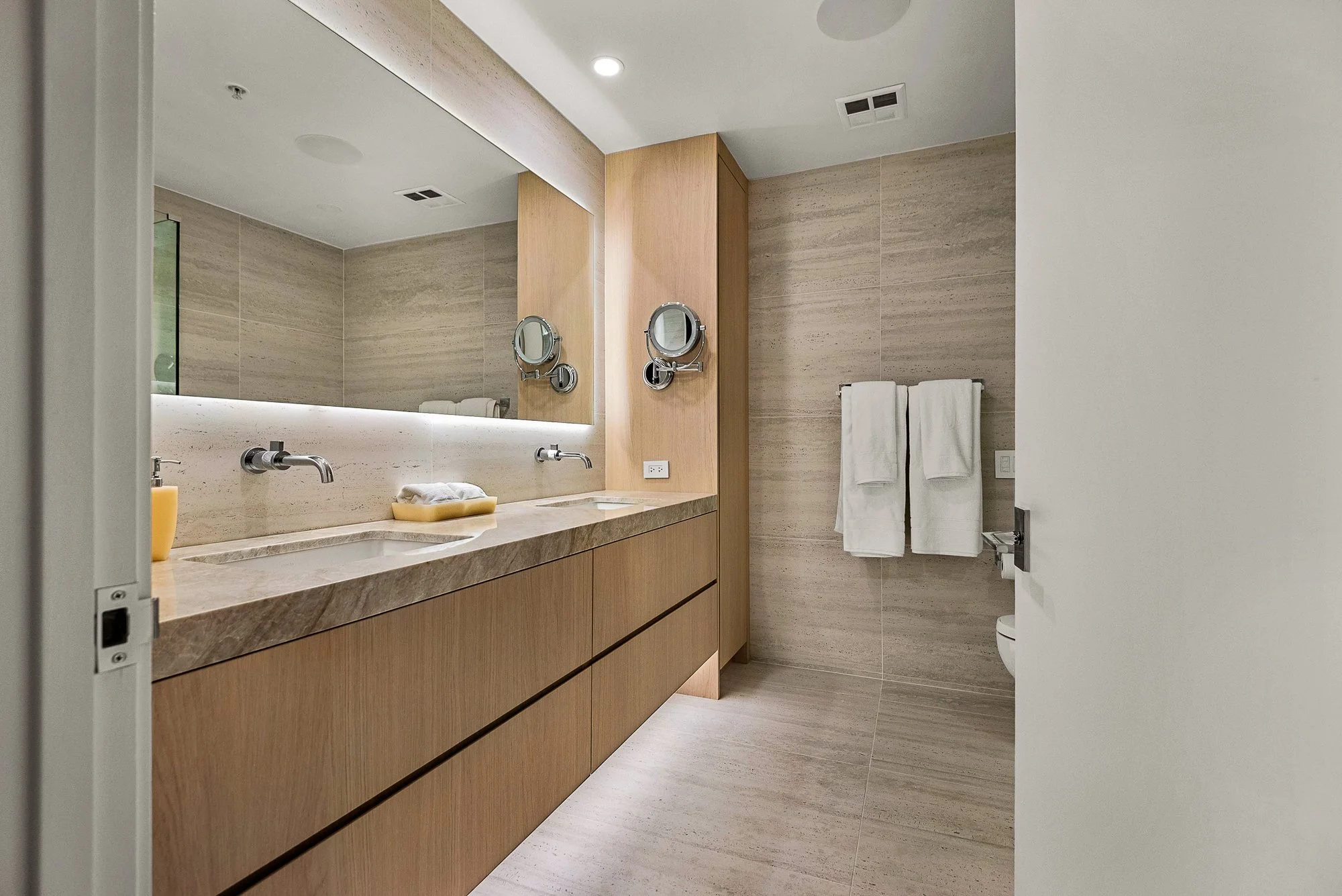 Custom-built white oak floating vanity by Madley Fine Cabinetry