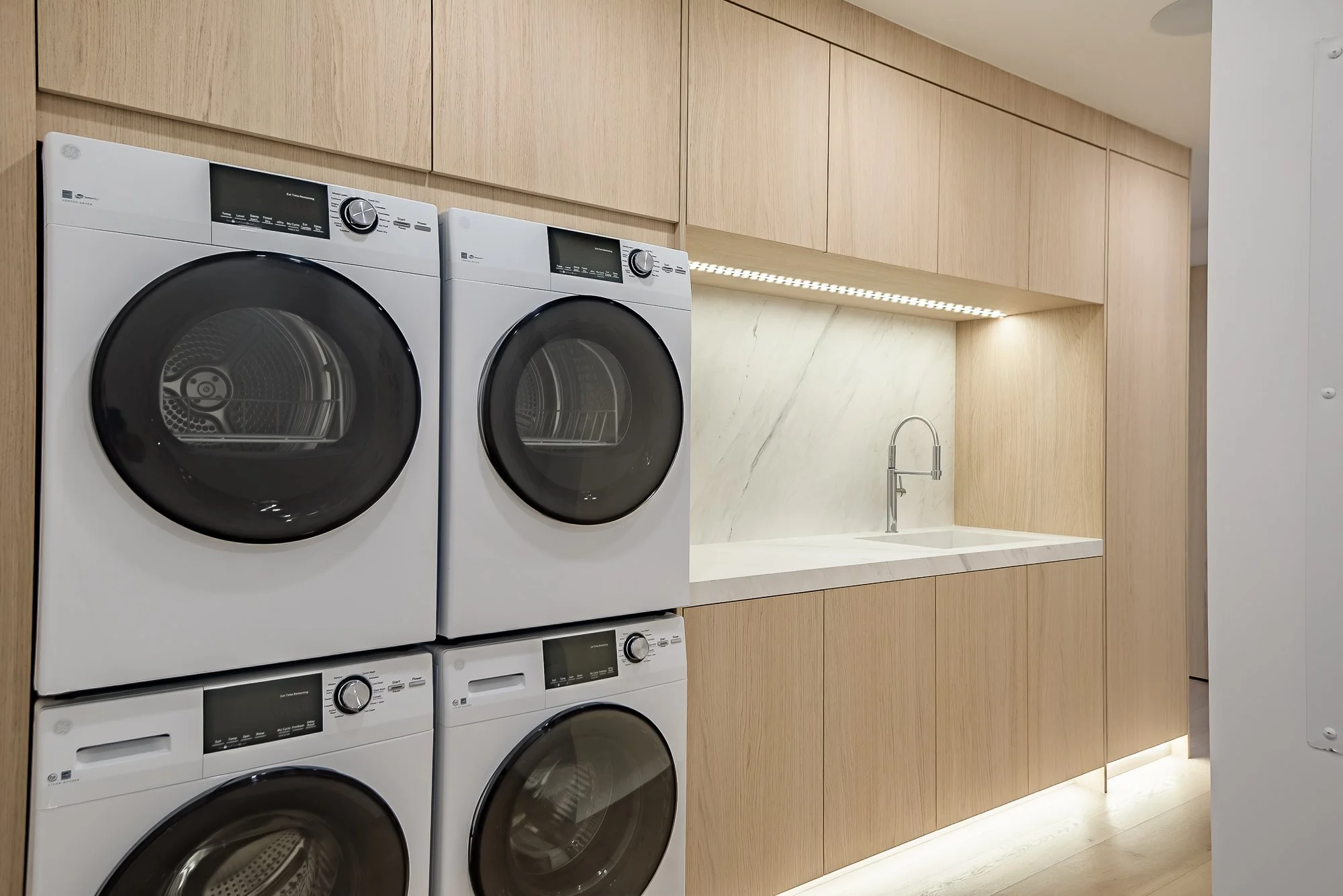 Modern minimalist white oak laundry room
