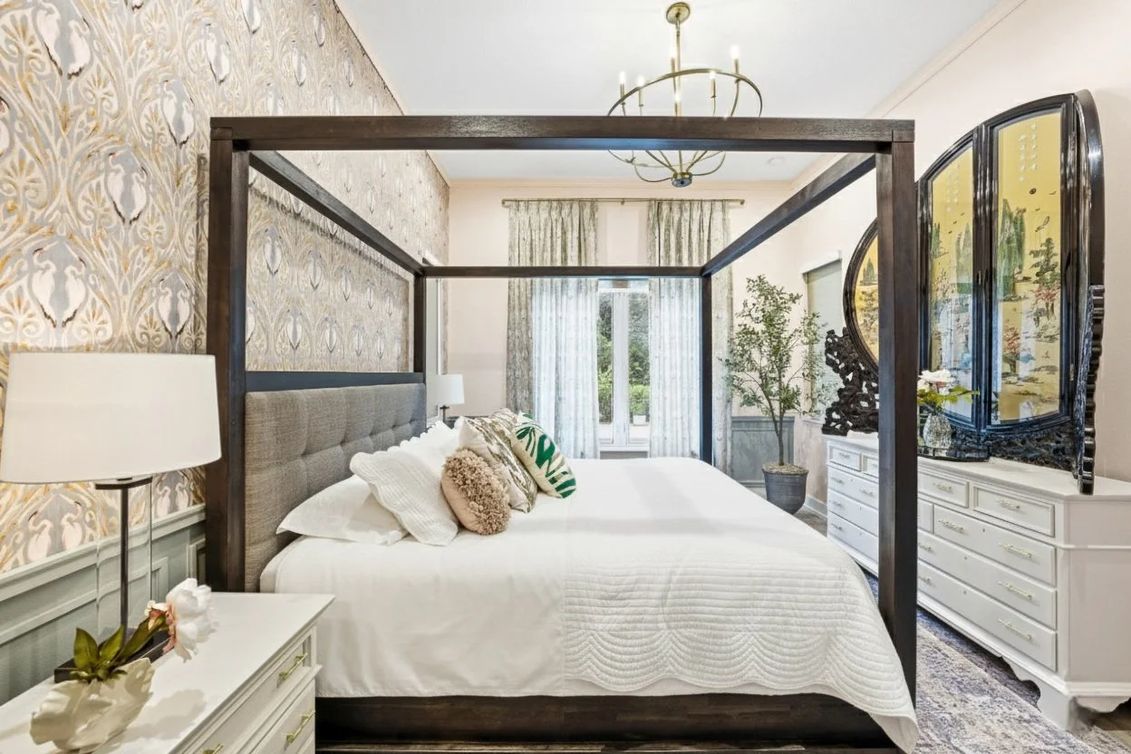 Contemporary bedroom with art deco design flourishes, chinoiserie ebony screen with semi-precious stones and coral, wrapped in tones of soft peach, sage, and gray