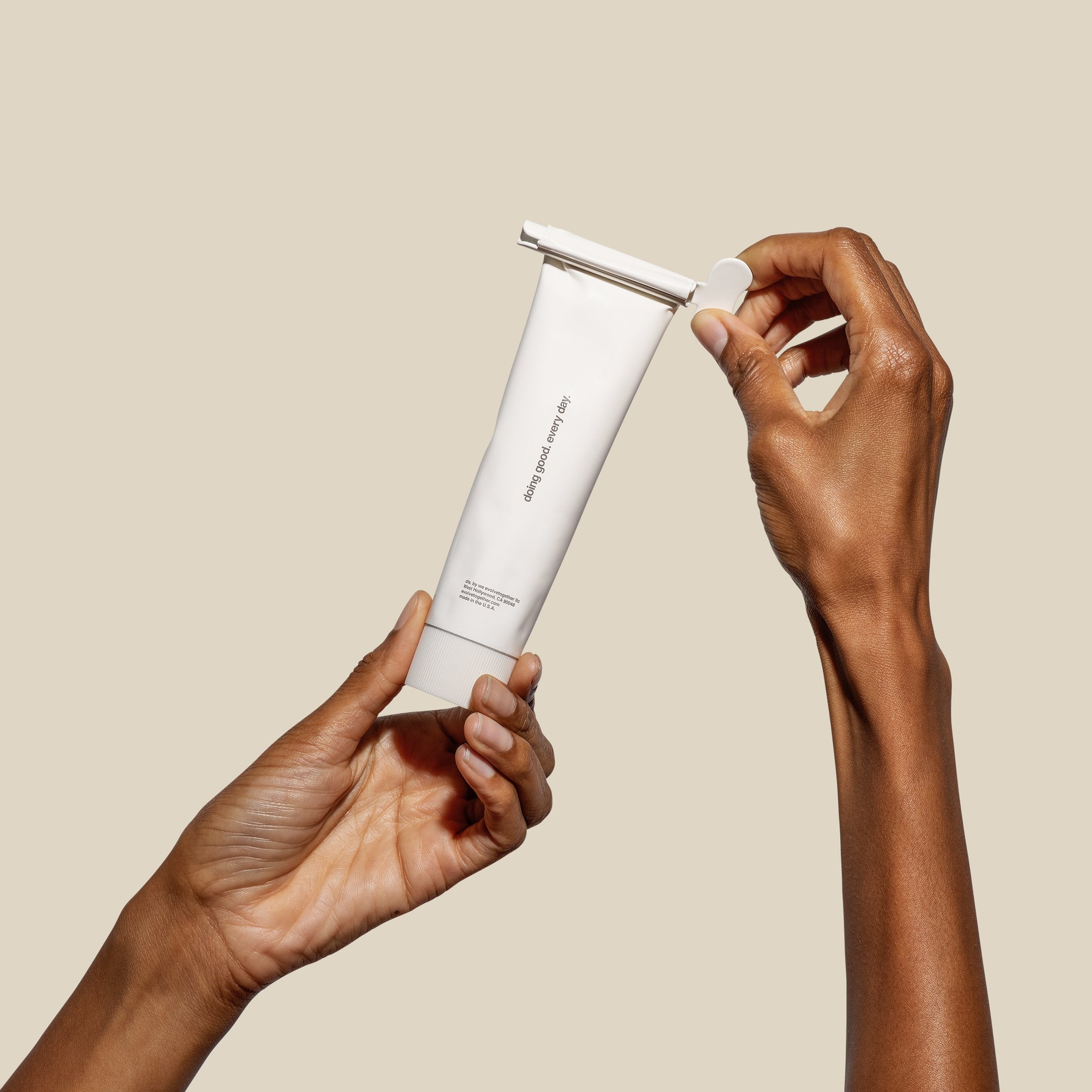 evolvetogether hydrating body cream held in hand (Copy)