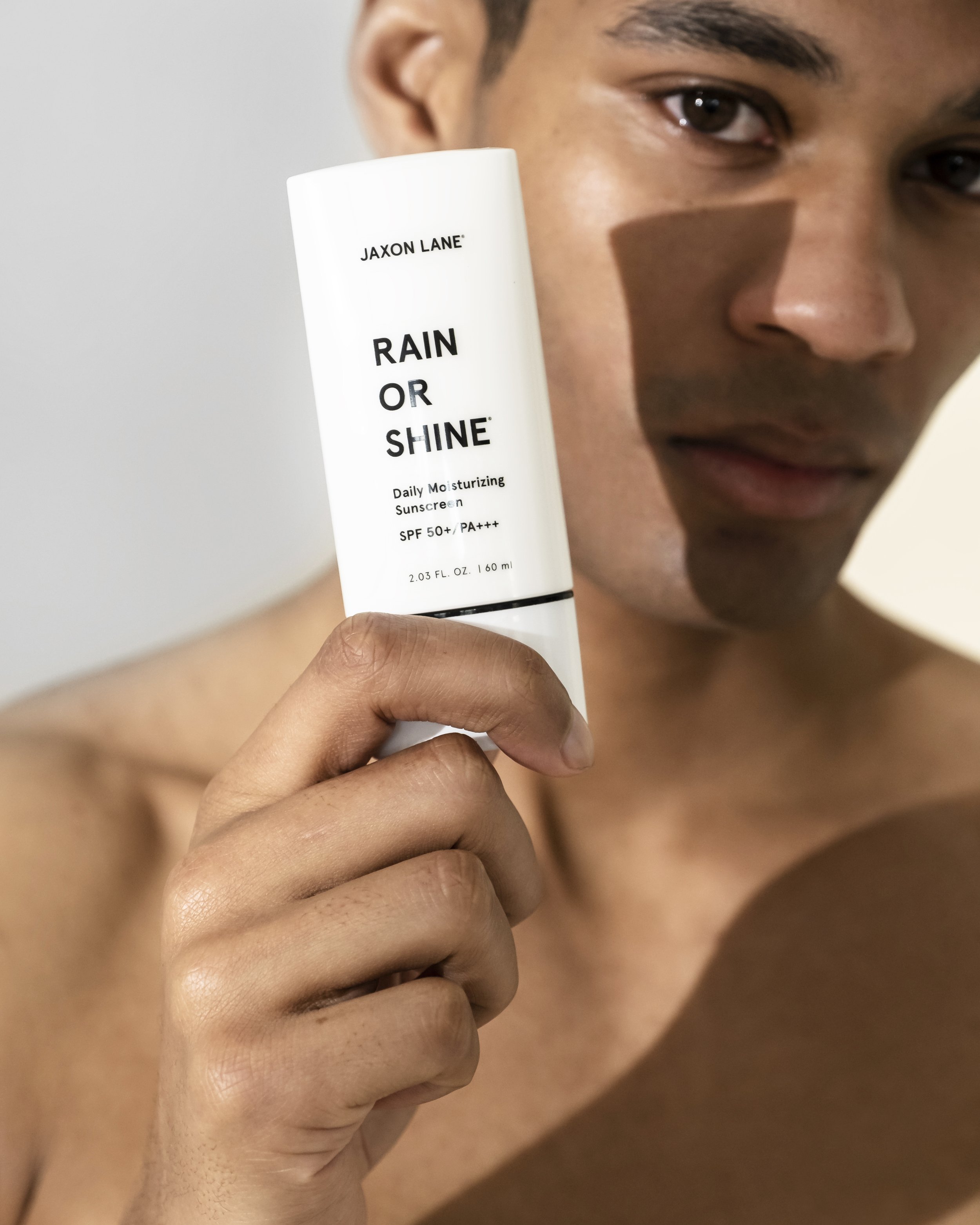 Jaxon Lane Rain Or Shine SPF 50+ in hand