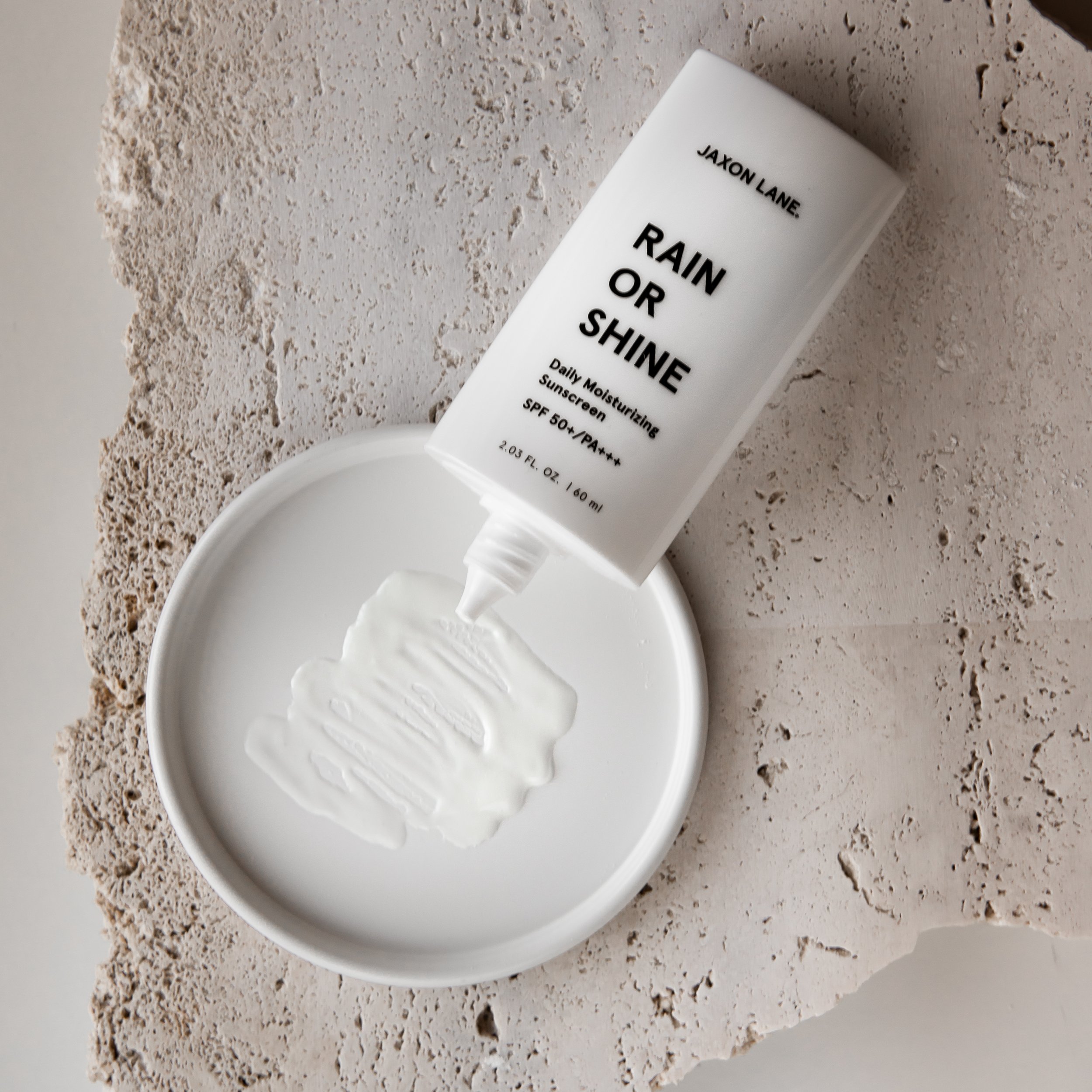 Jaxon Lane Rain Or Shine SPF 50+ squeezed out