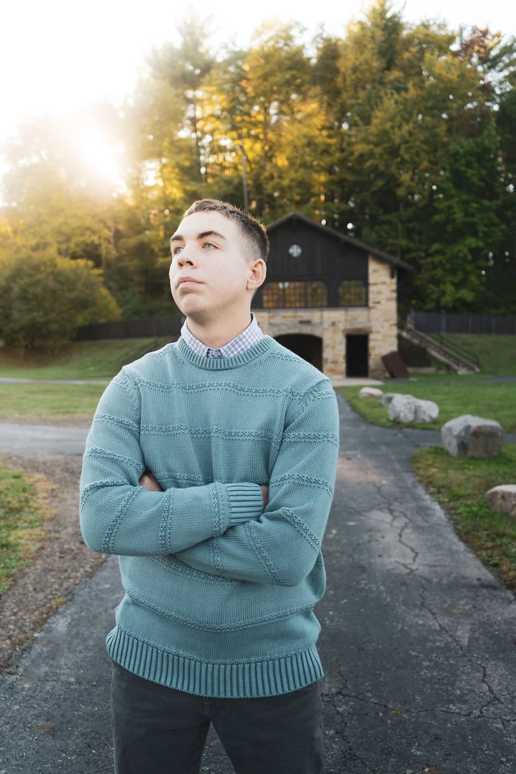 Senior pictures at the Ledges in Cuyahoga Valley National Park, with a young man standing beside rocks