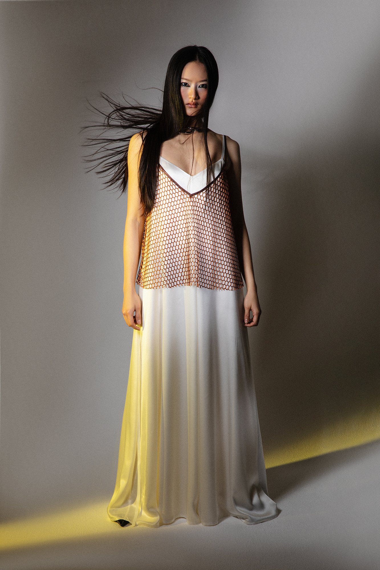 INNNA offers a midi white cream silk dress suitable for birthday parties, summer days, or evening weddings, perfect for both brides and bridesmaids. It is complemented well by a ginger cami top.
