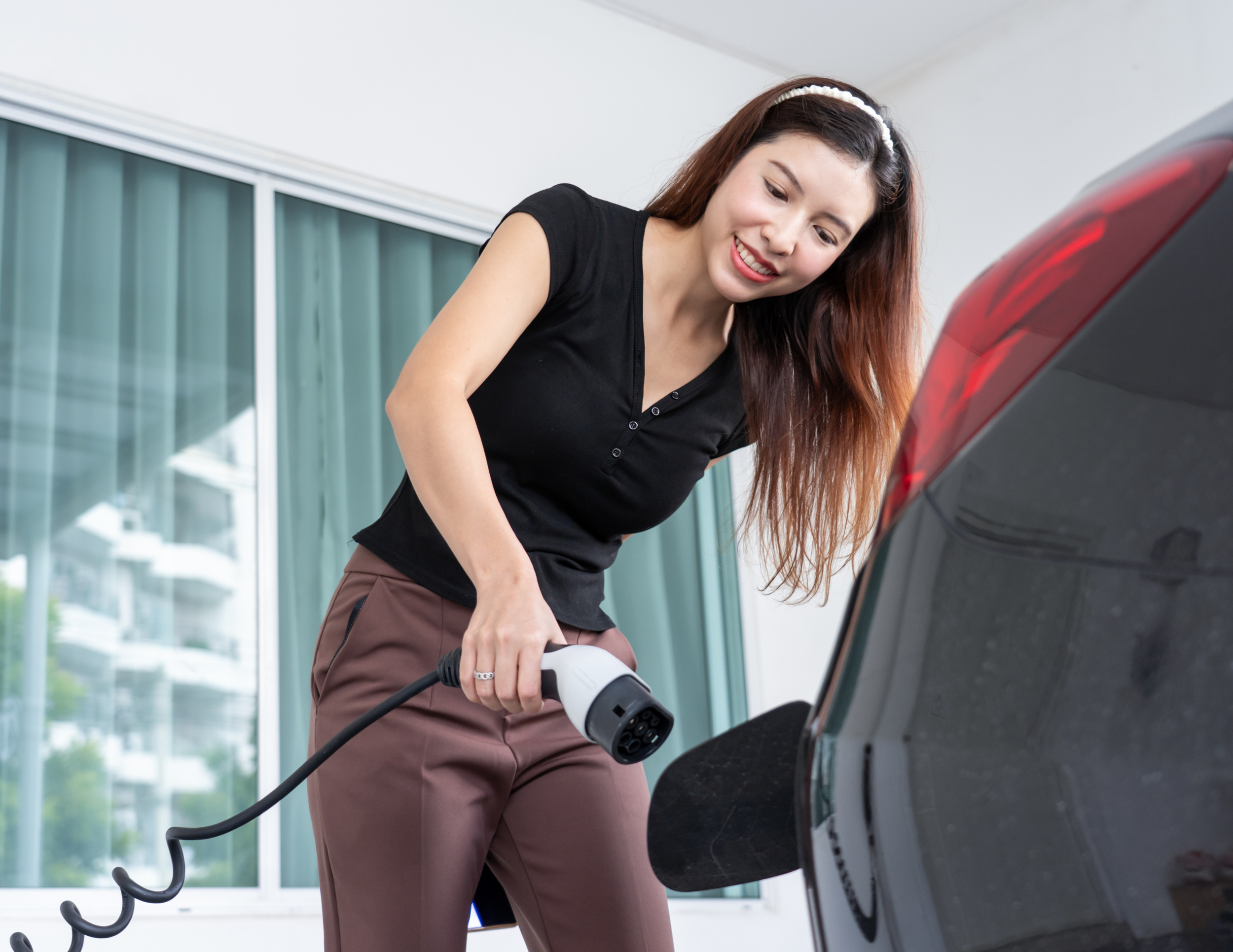 Woman with Fast Home EV Charger