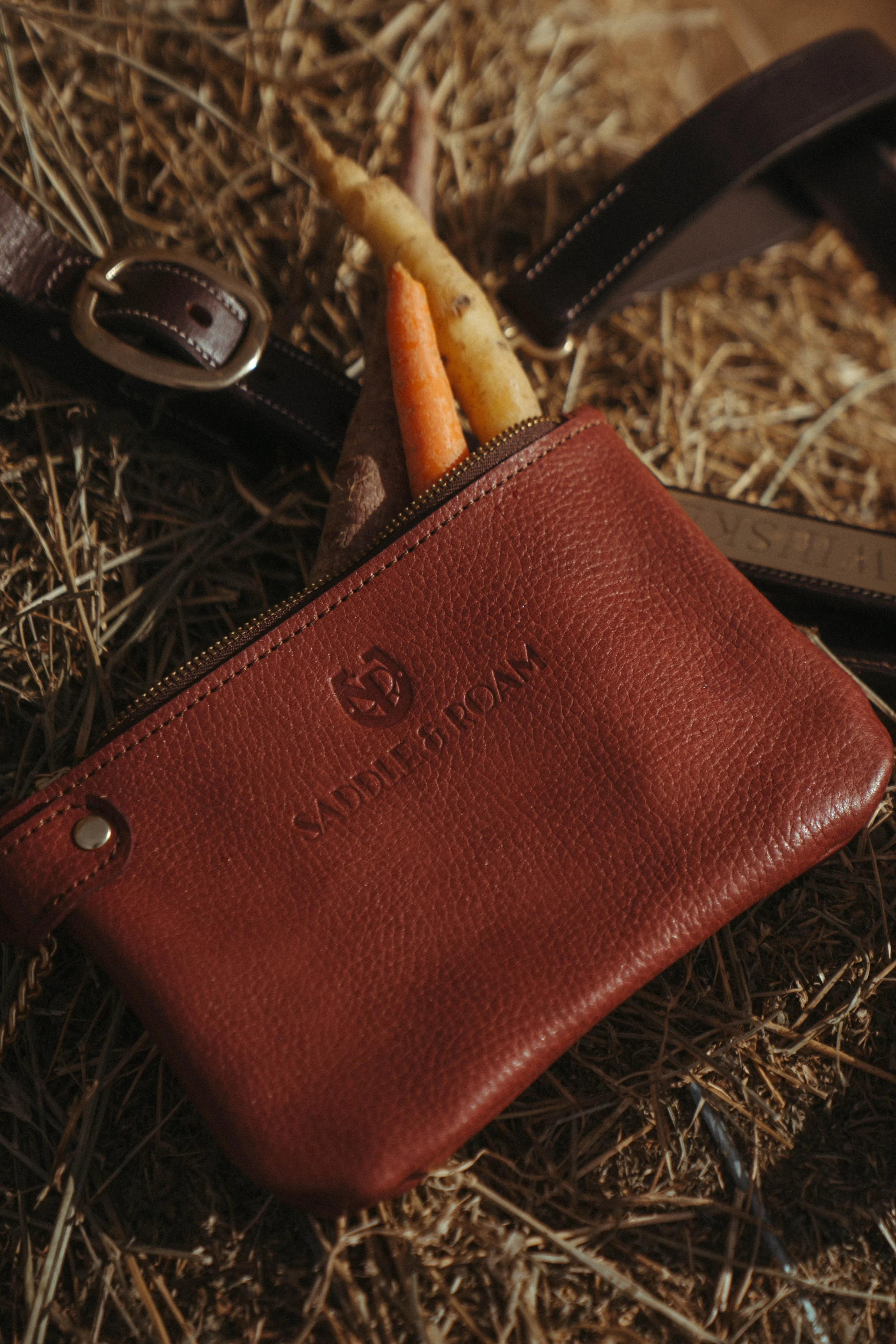 Equestrian product-style photographs featuring a tote bag and jacket in a beautiful outdoor setting, showcasing the product, equestrian lifestyle, and connection with the  horse life through natural, editorial-inspired imagery.