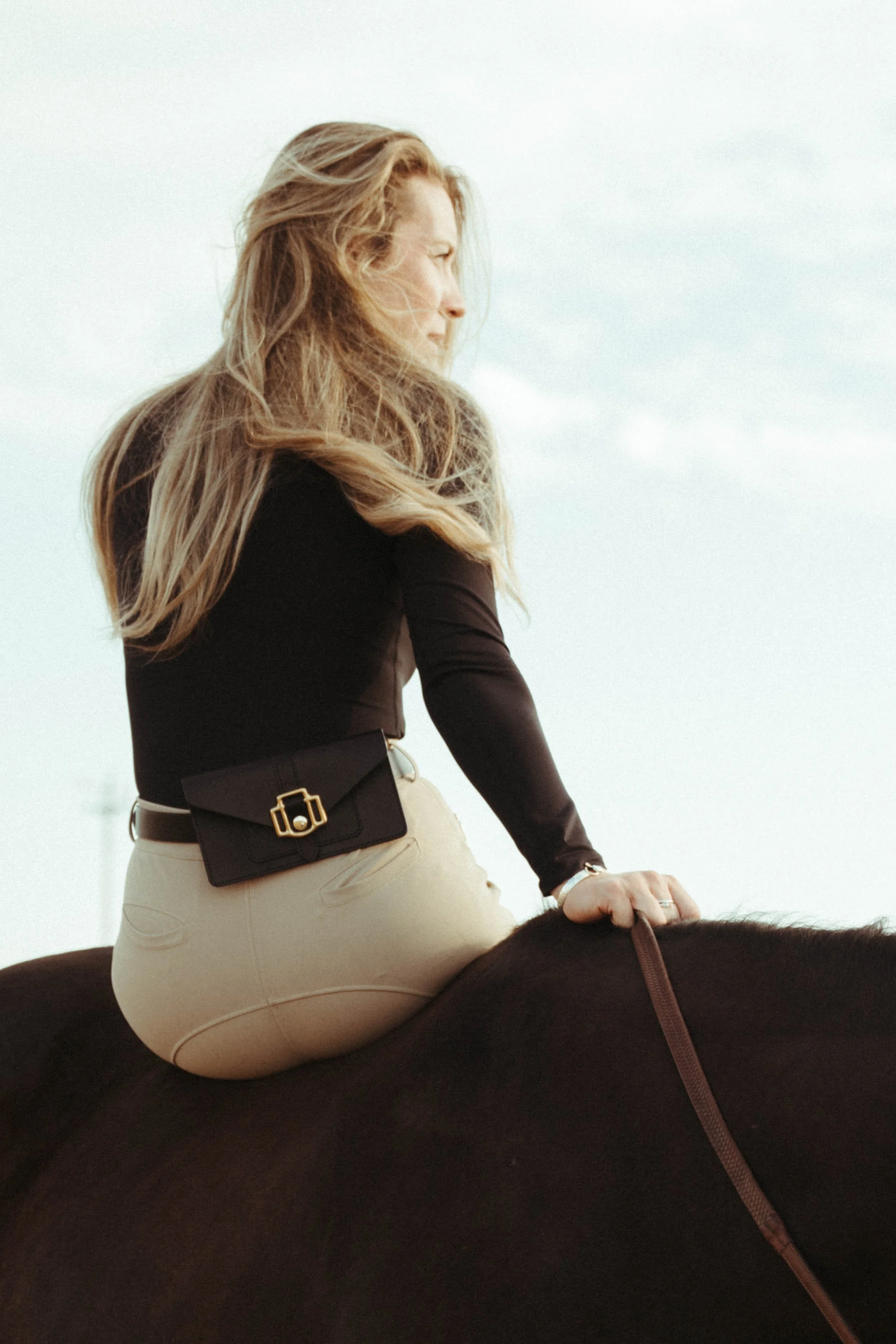 Equestrian portrait-style photographs featuring a woman with her horse in a beautiful outdoor setting, showcasing her riding style, equestrian lifestyle, and connection with her horse through natural, editorial-inspired imagery.