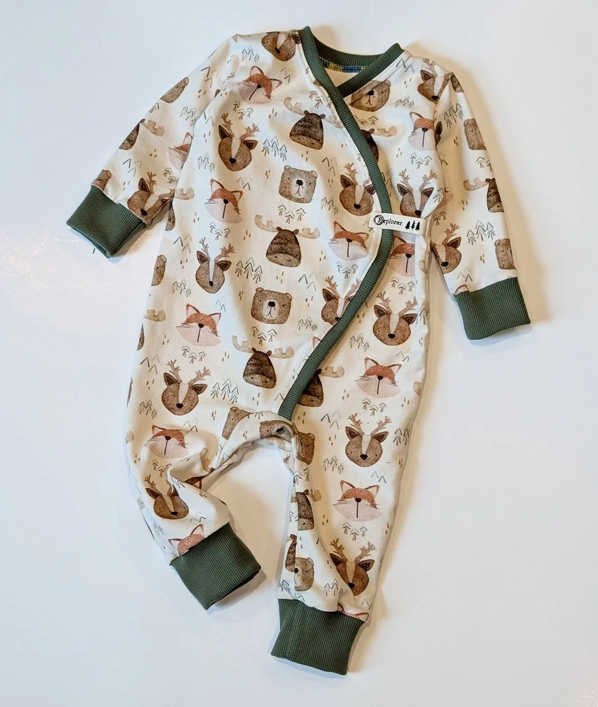 This design by @beekyillustration printed on @naturalrootsfabric new natural line is adorable and perfect for little baby rompers!! Tried out my new open ring snaps and the printed twill tape from @shinebrightlabelco adds the perfect finishing touch!