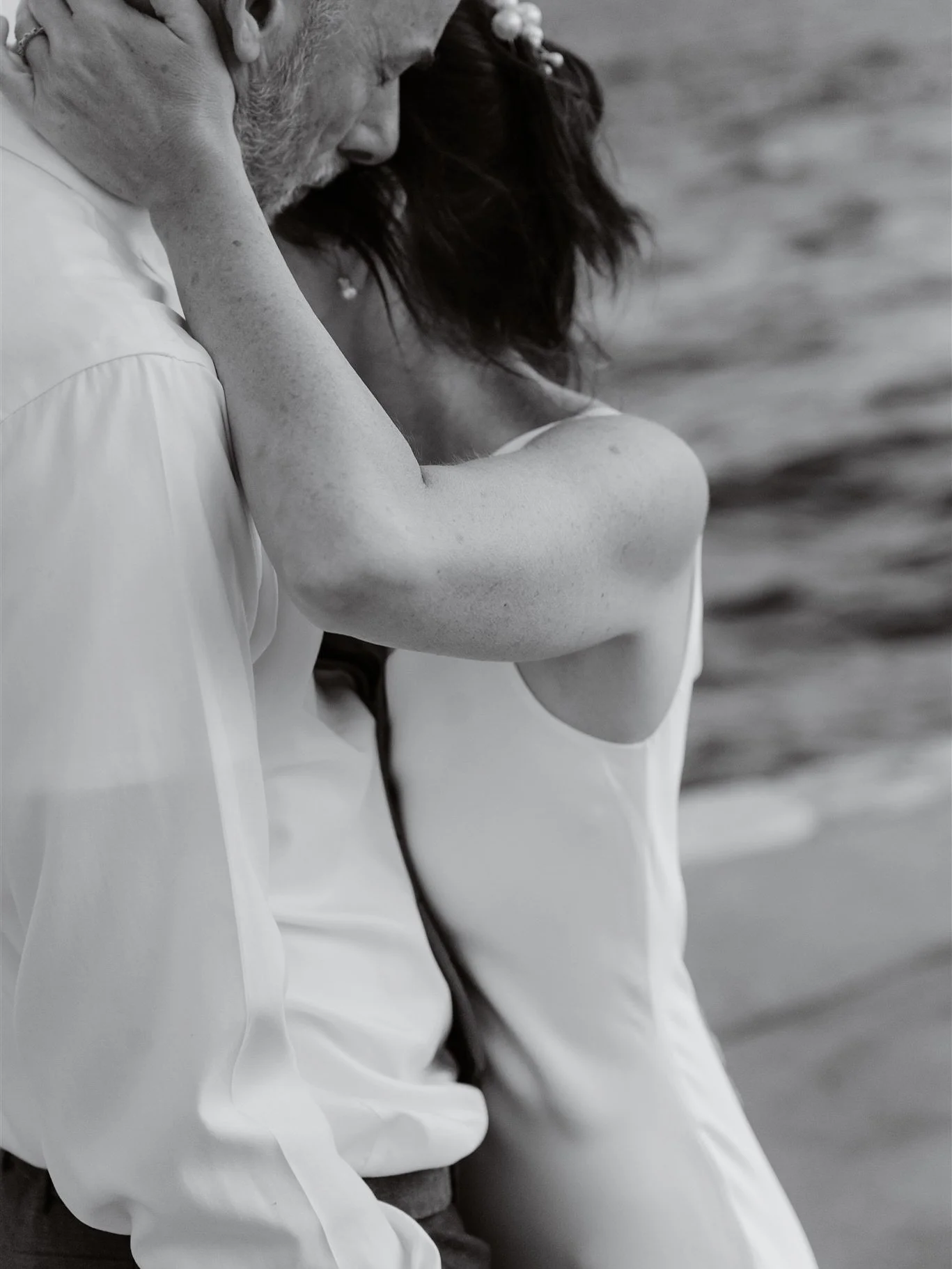 As the ceremony began, raindrops traced the stone colonnades of Beach Club Hvar ~ a storm rolling softly over the Adriatic. Then, as vows were spoken, the sky broke open: clouds dissolving, light spilling across the sea. What followed was a celebrati