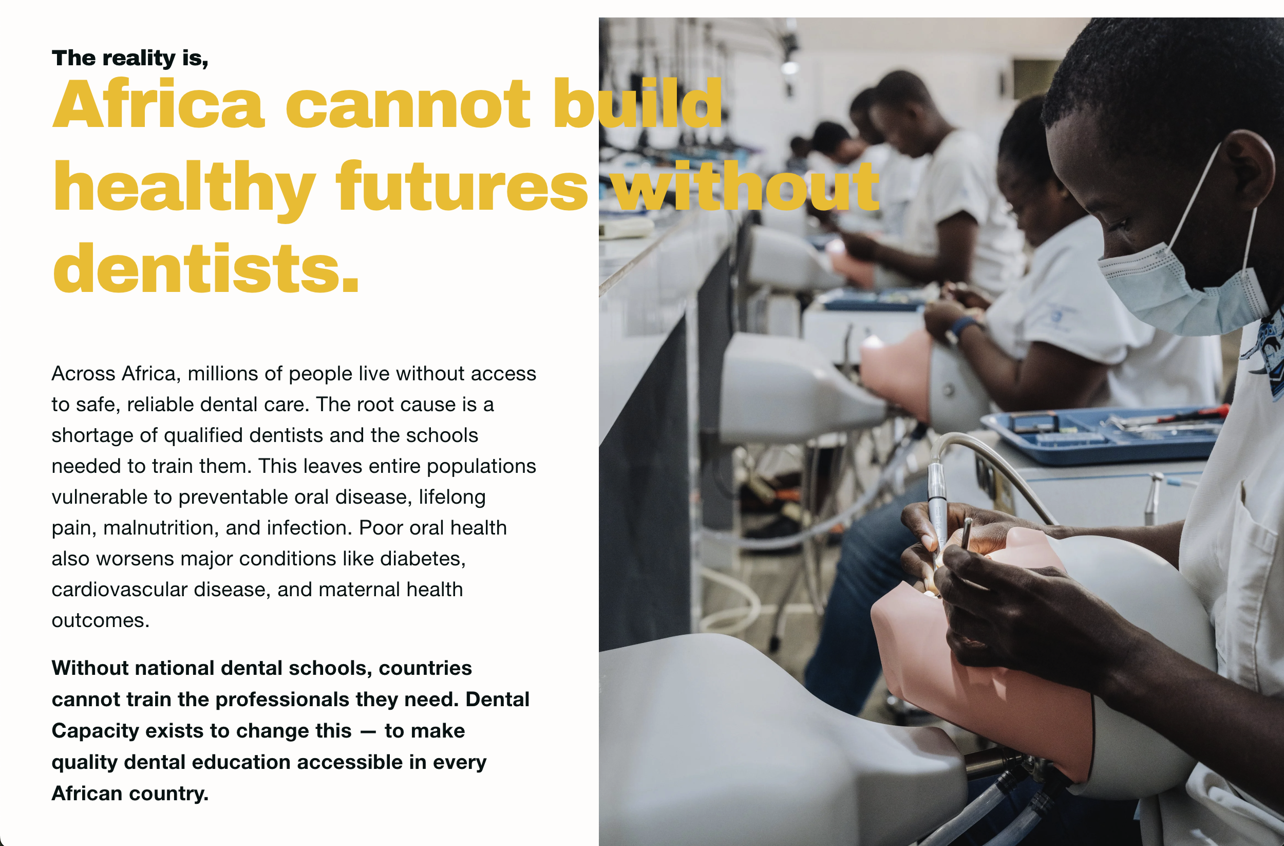 A group of African dental students wearing white uniforms and face masks practicing dentistry on dental mannequins in a classroom or training lab.