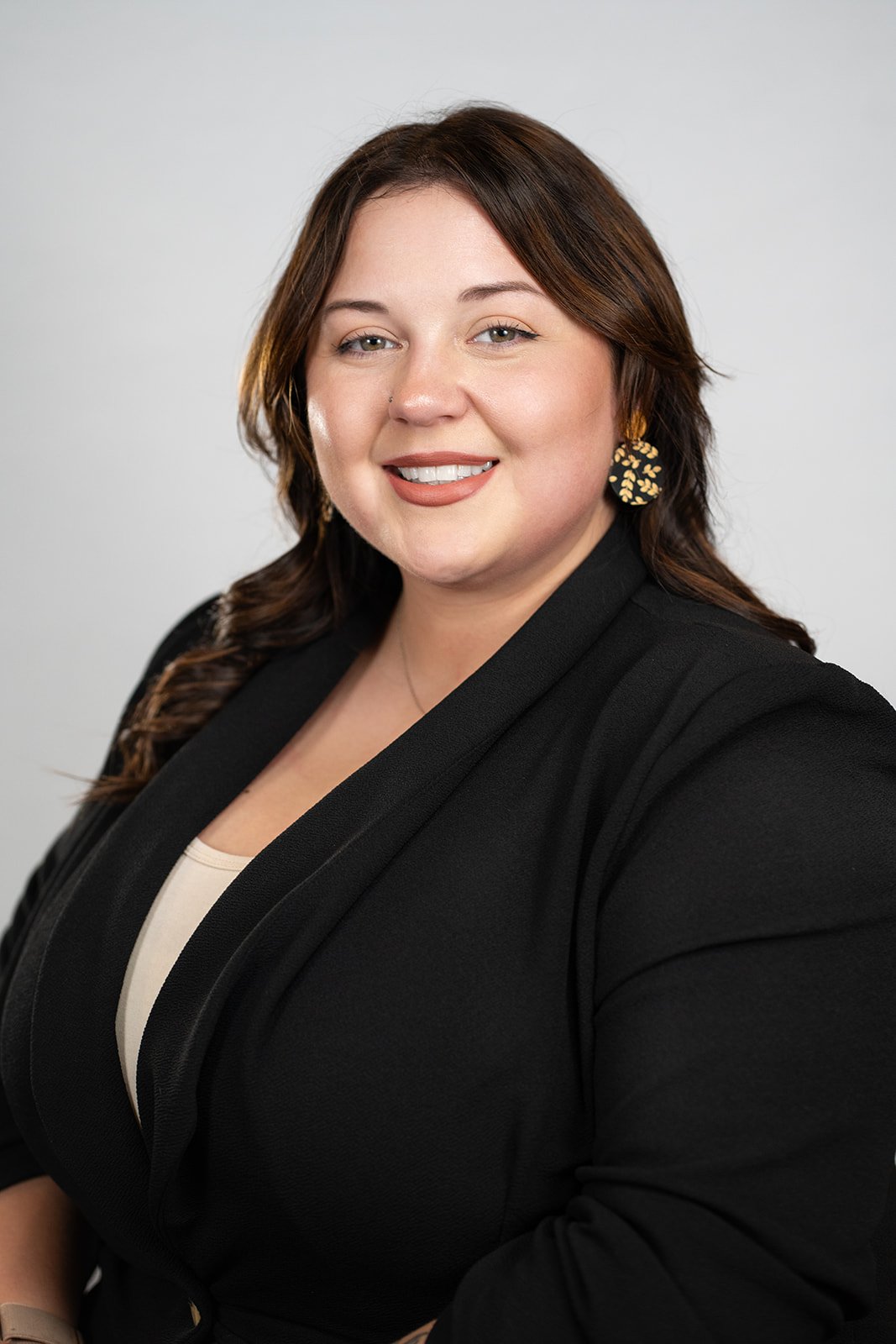 Professional Realtor headshot of a woman in front of a white background