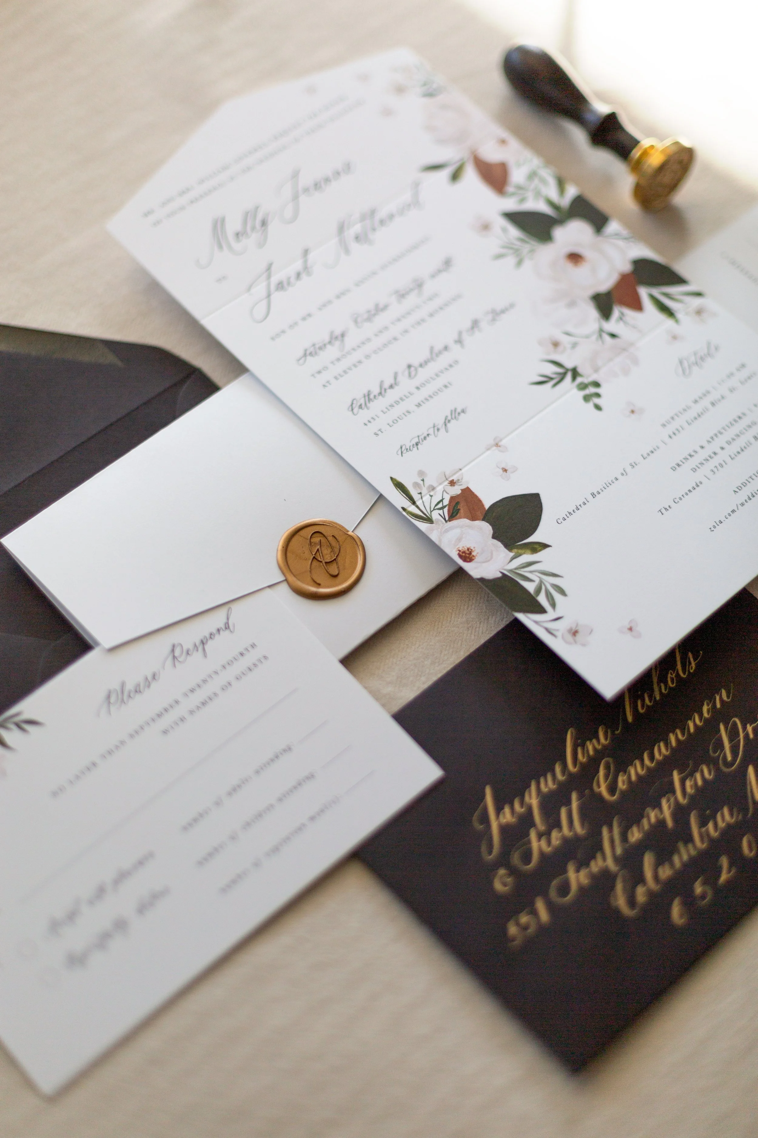 all in one folded invitation suite with black and white floral illustration and gold calligraphy