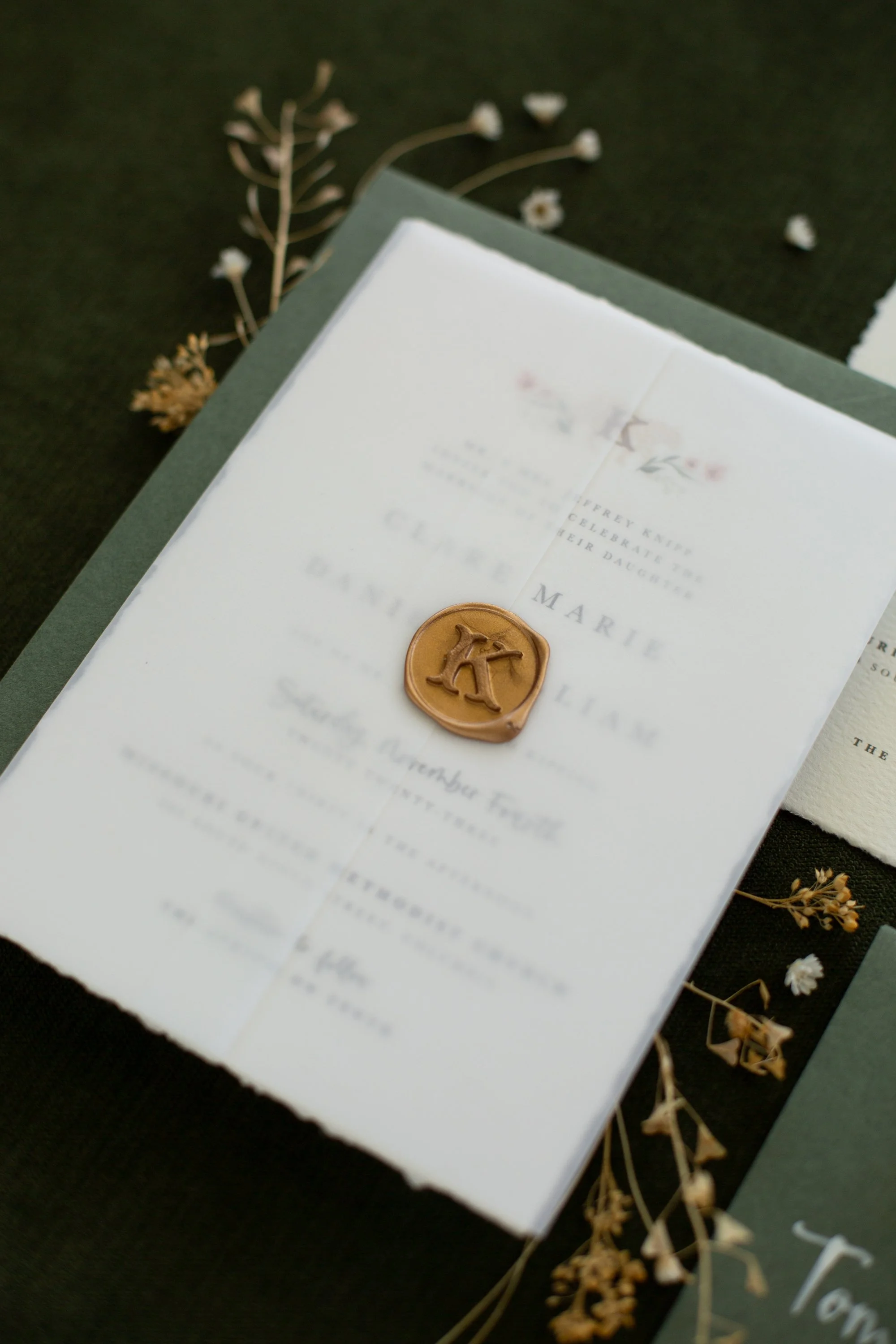 gold monogram wax seal with vellum wrap on hand painted wedding invitation suite